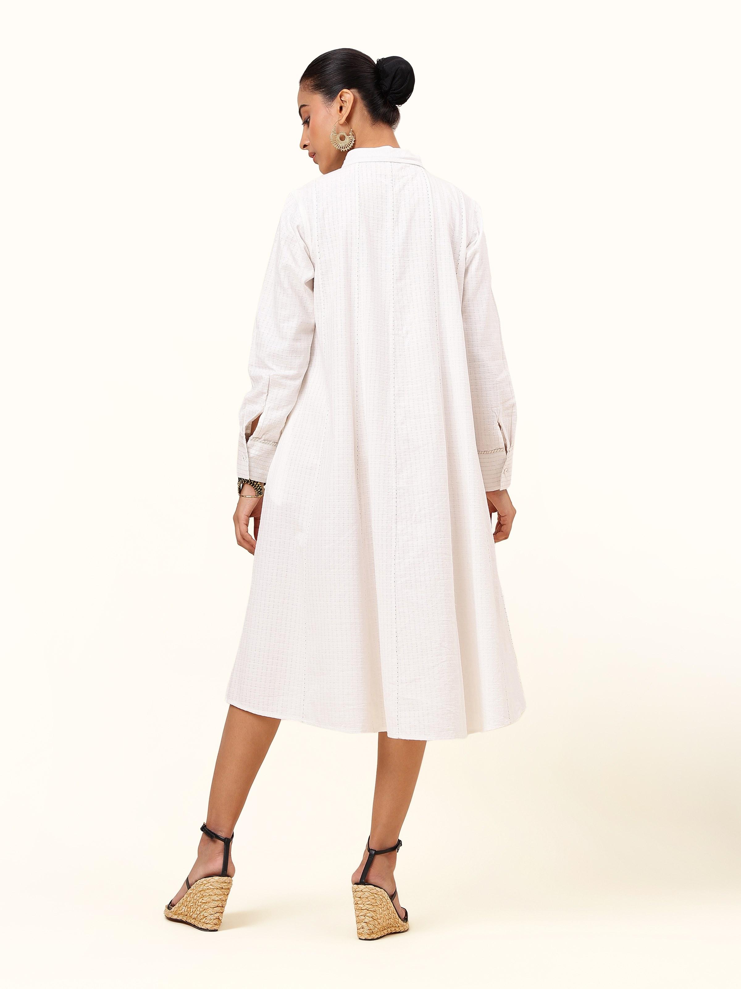 Back view of off-white cotton panelled straight dress with simple seam lines