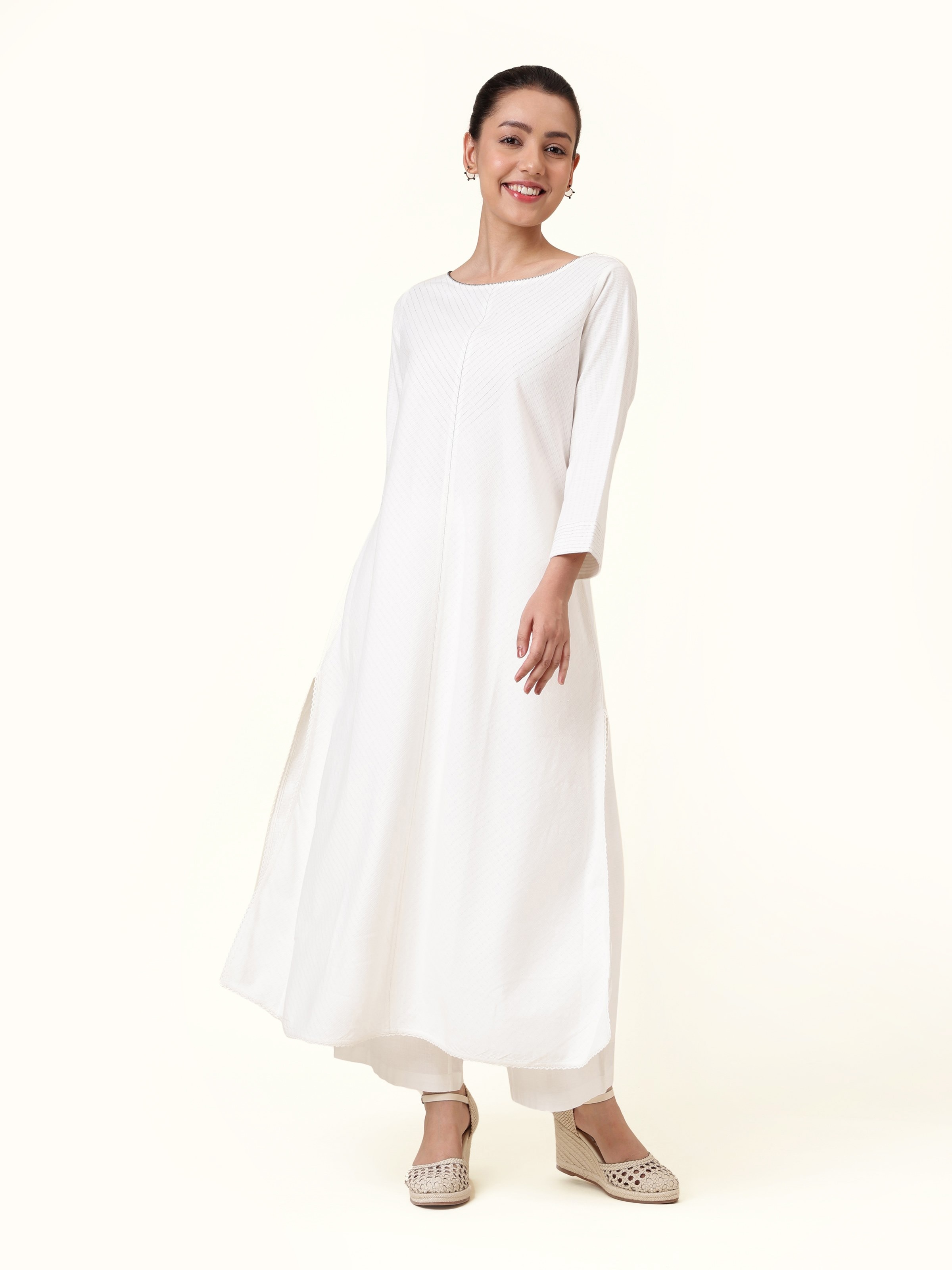 Front view of off-white cotton kurta with straight fit and minimal design