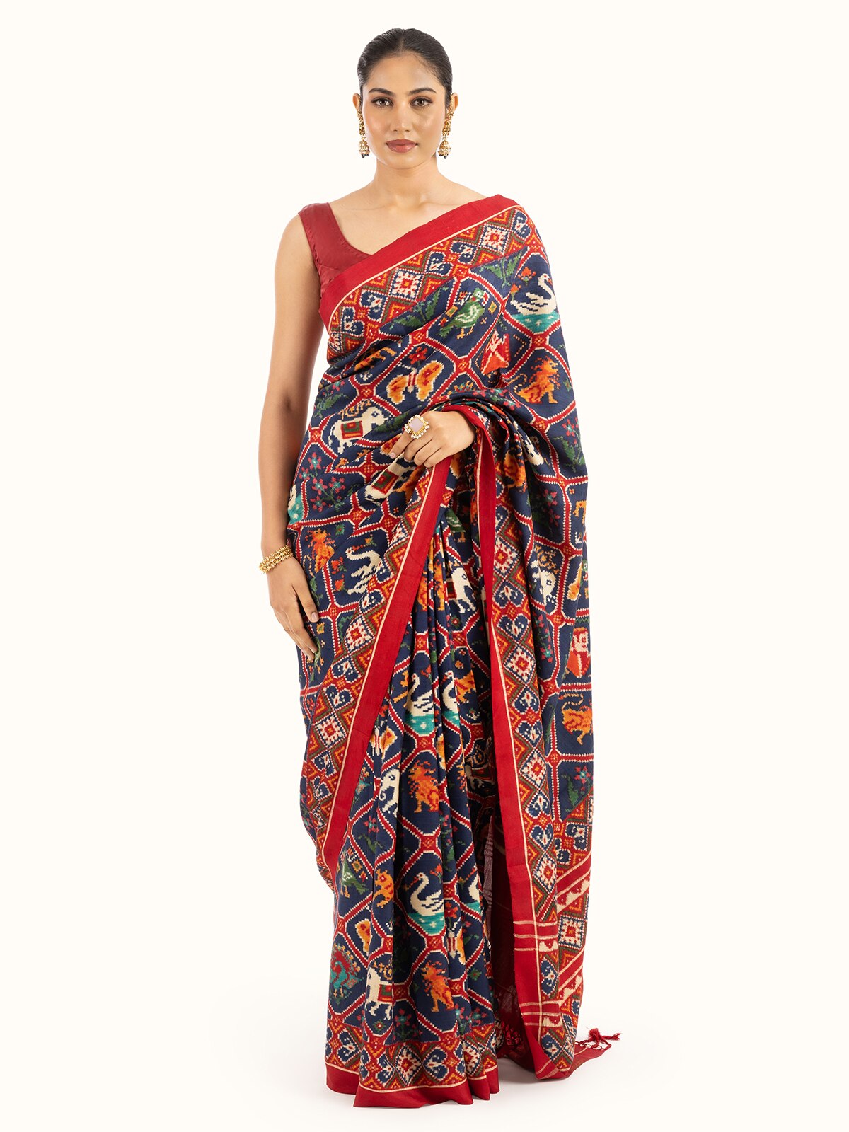 Front view of navy blue mulberry silk patan patola saree showcasing deep colors and traditional patterns