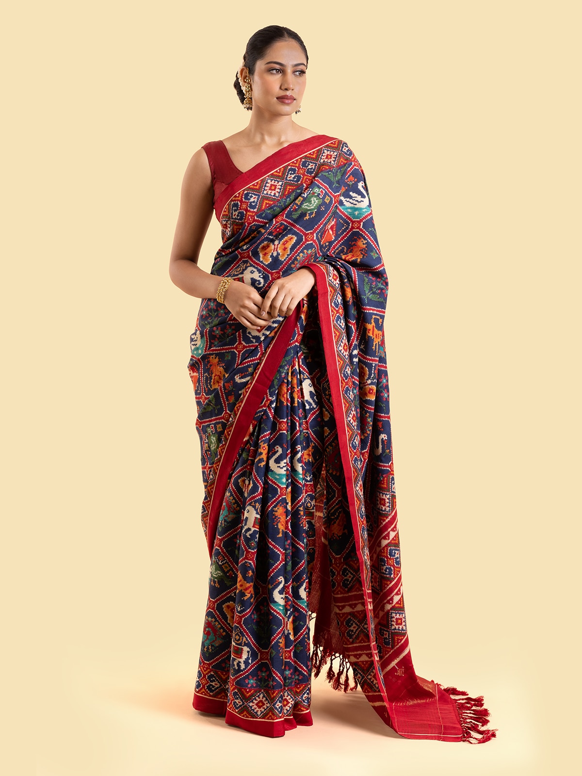 Side view of navy blue mulberry silk patan patola saree highlighting luxurious silk texture and embroidery