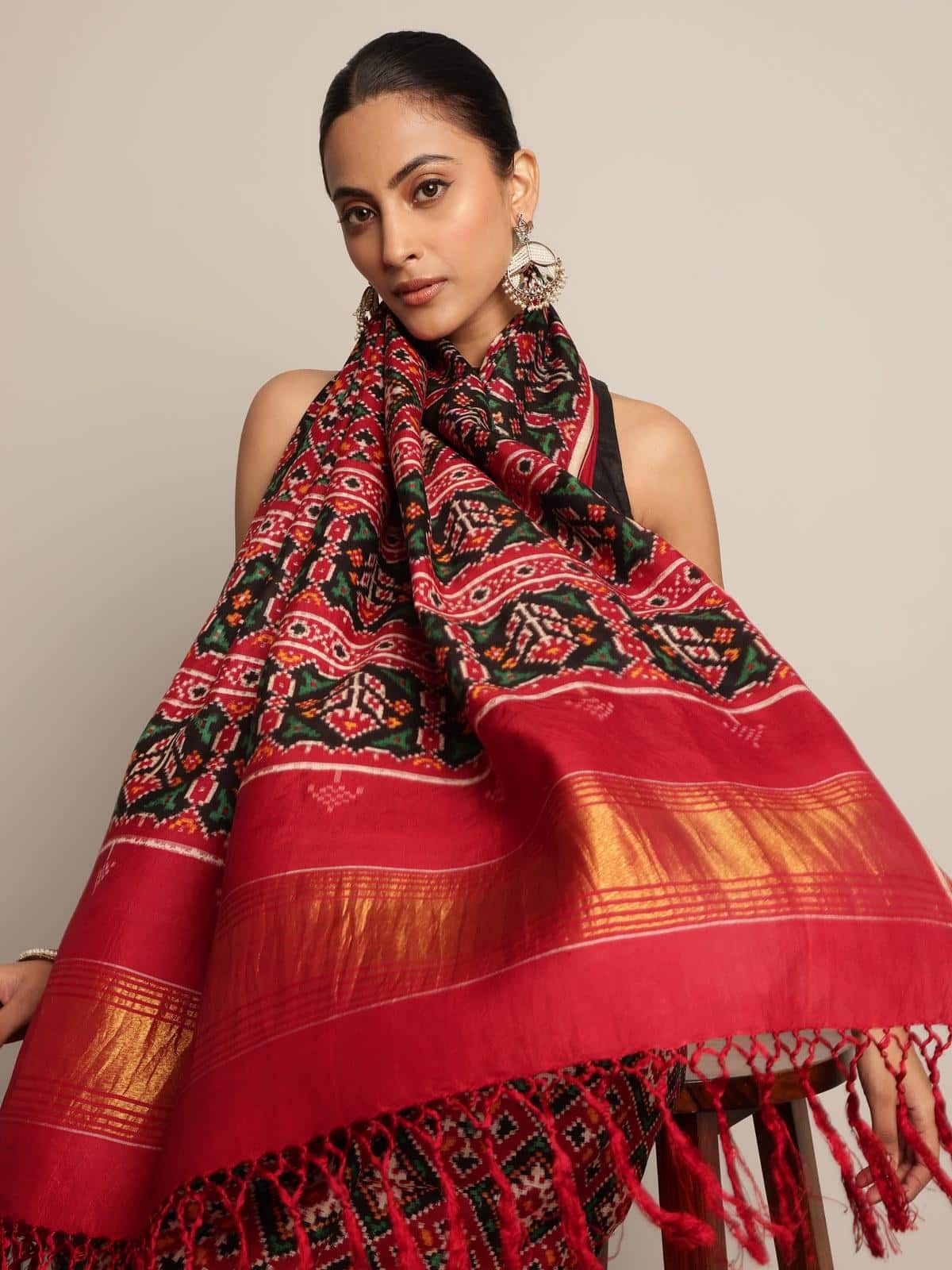 Close-up detail of Red & Green Mulberry Silk Patan Patola Saree focusing on detailed weaving and silk sheen.