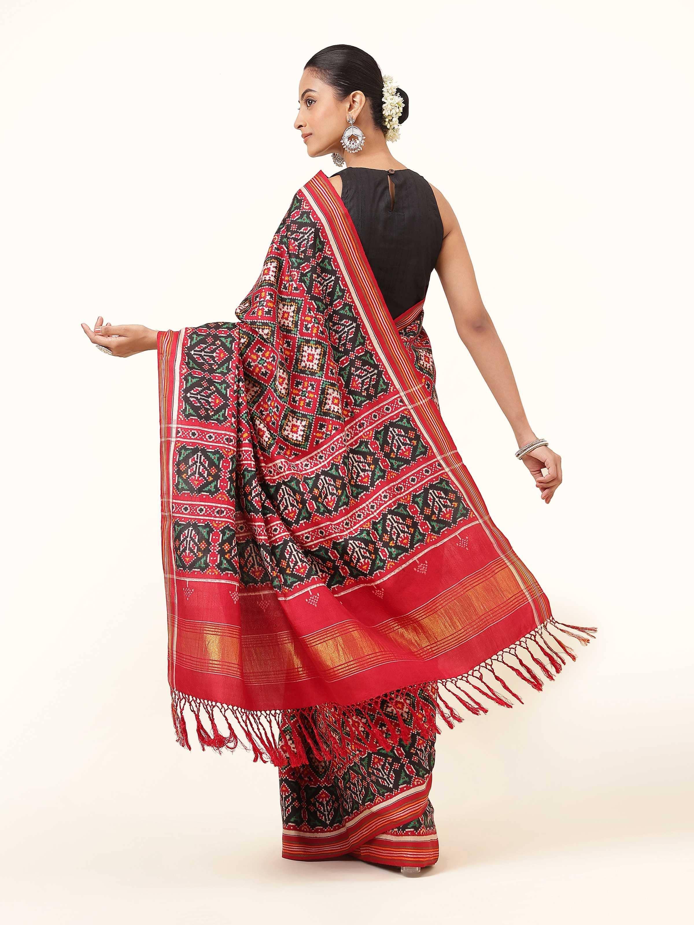 Back view of Red & Green Mulberry Silk Patan Patola Saree showing pallu and border design.
