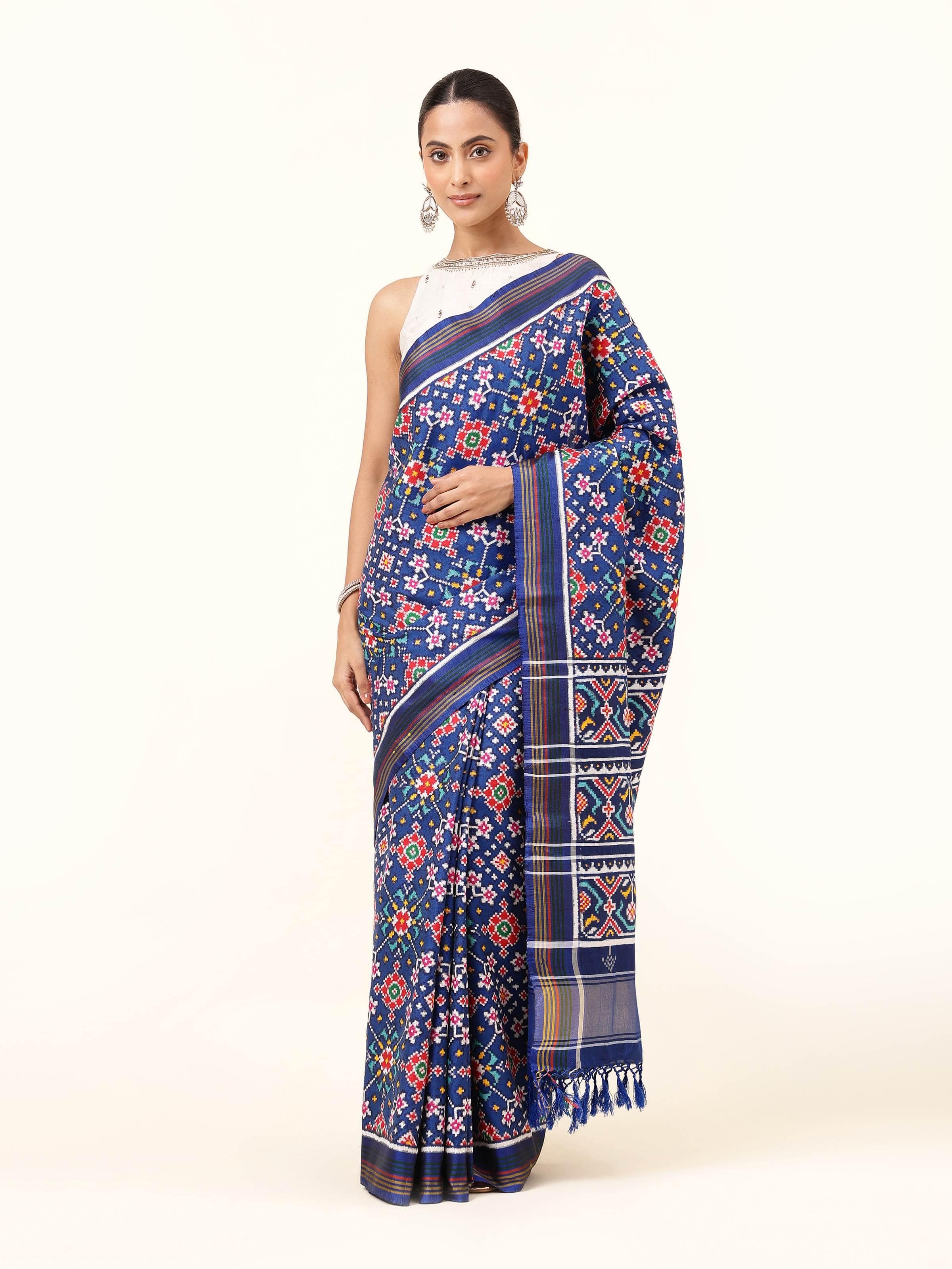Front view of cobalt blue Patan Patola saree in mulberry silk with traditional ikat motifs.