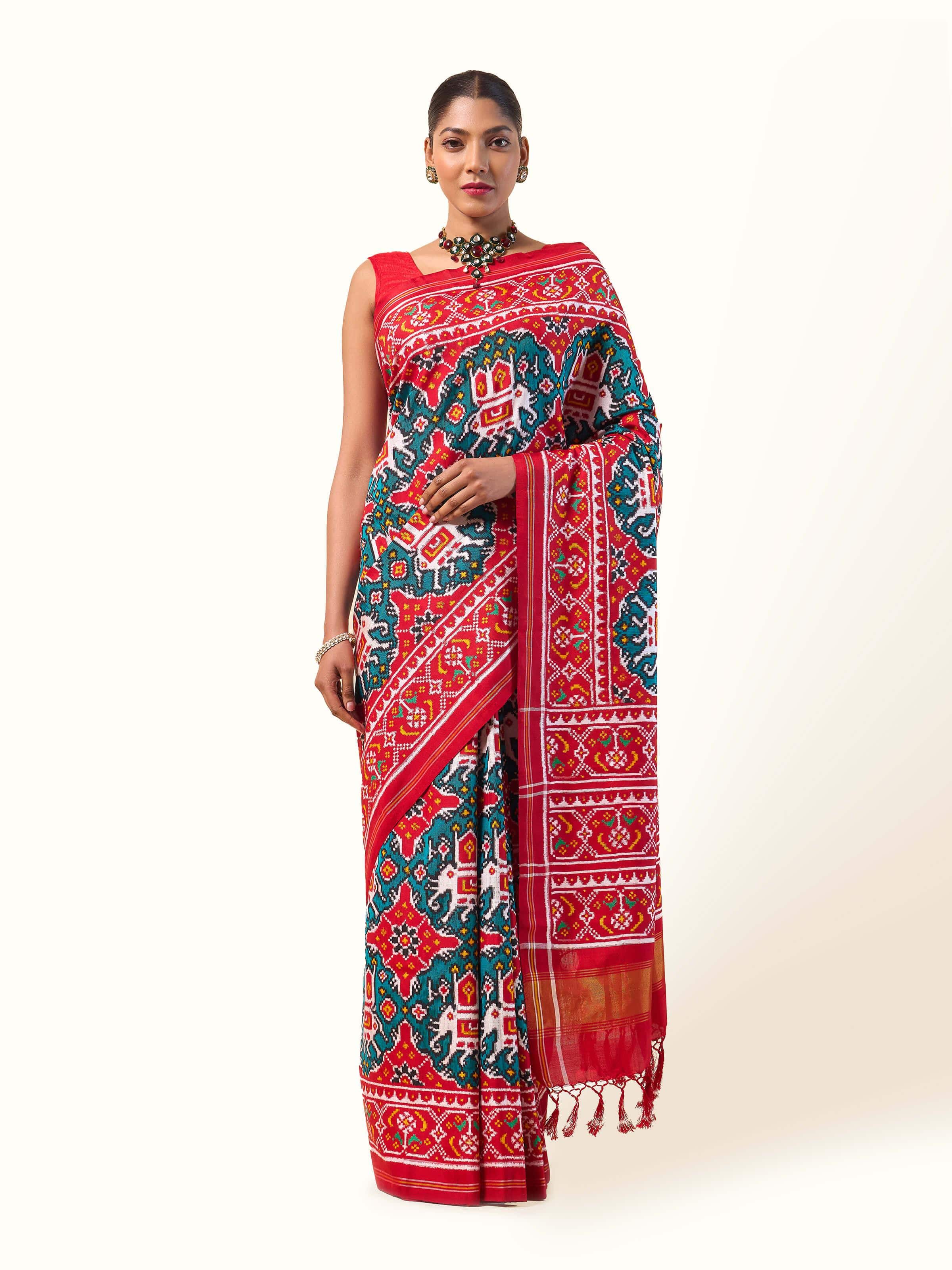 Front view of Green Mulberry Silk Patan Patola Saree displaying rich green silk and intricate Patola design.