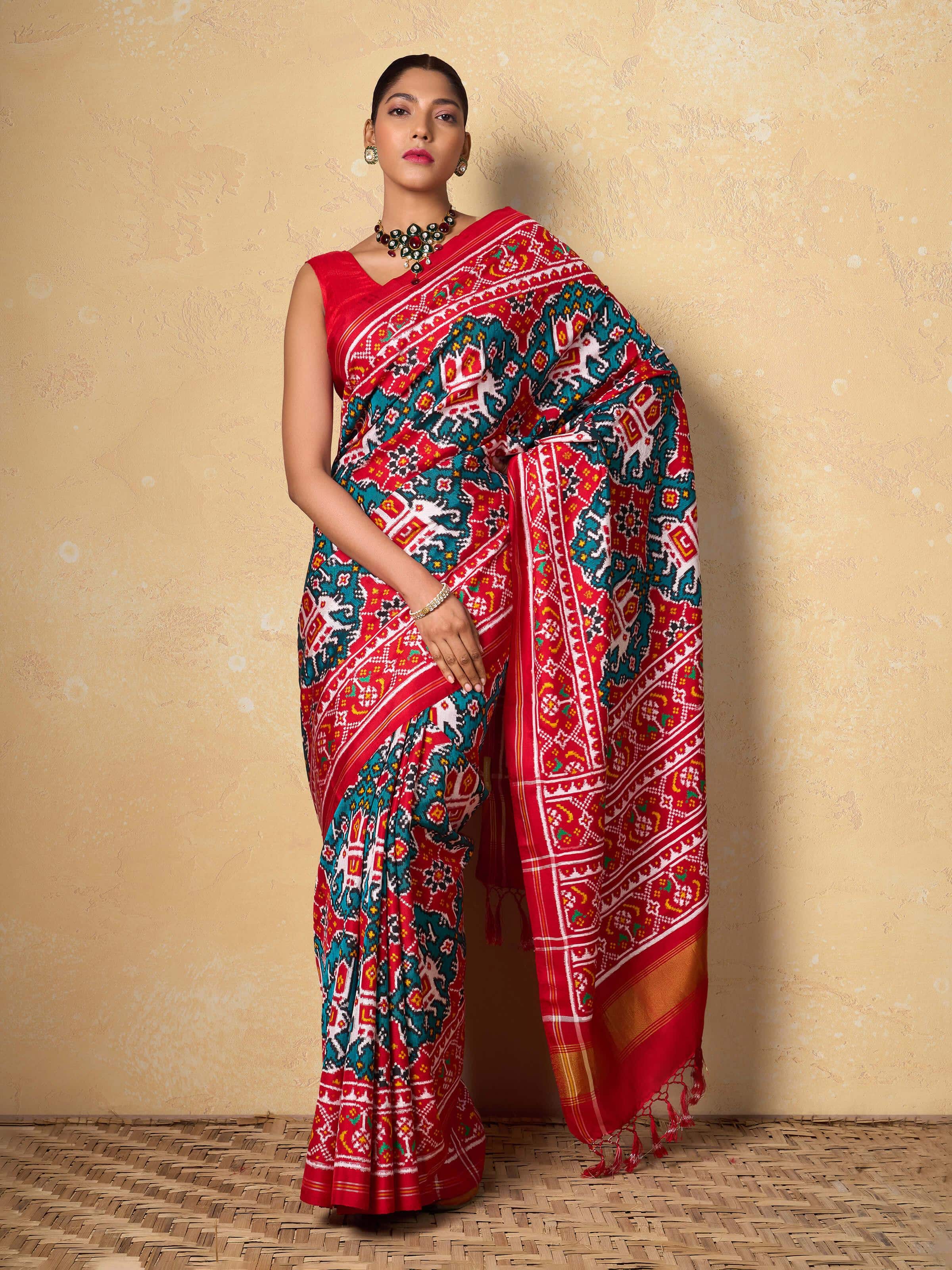 Lifestyle view of Green Mulberry Silk Patan Patola Saree draped on model showcasing elegance.