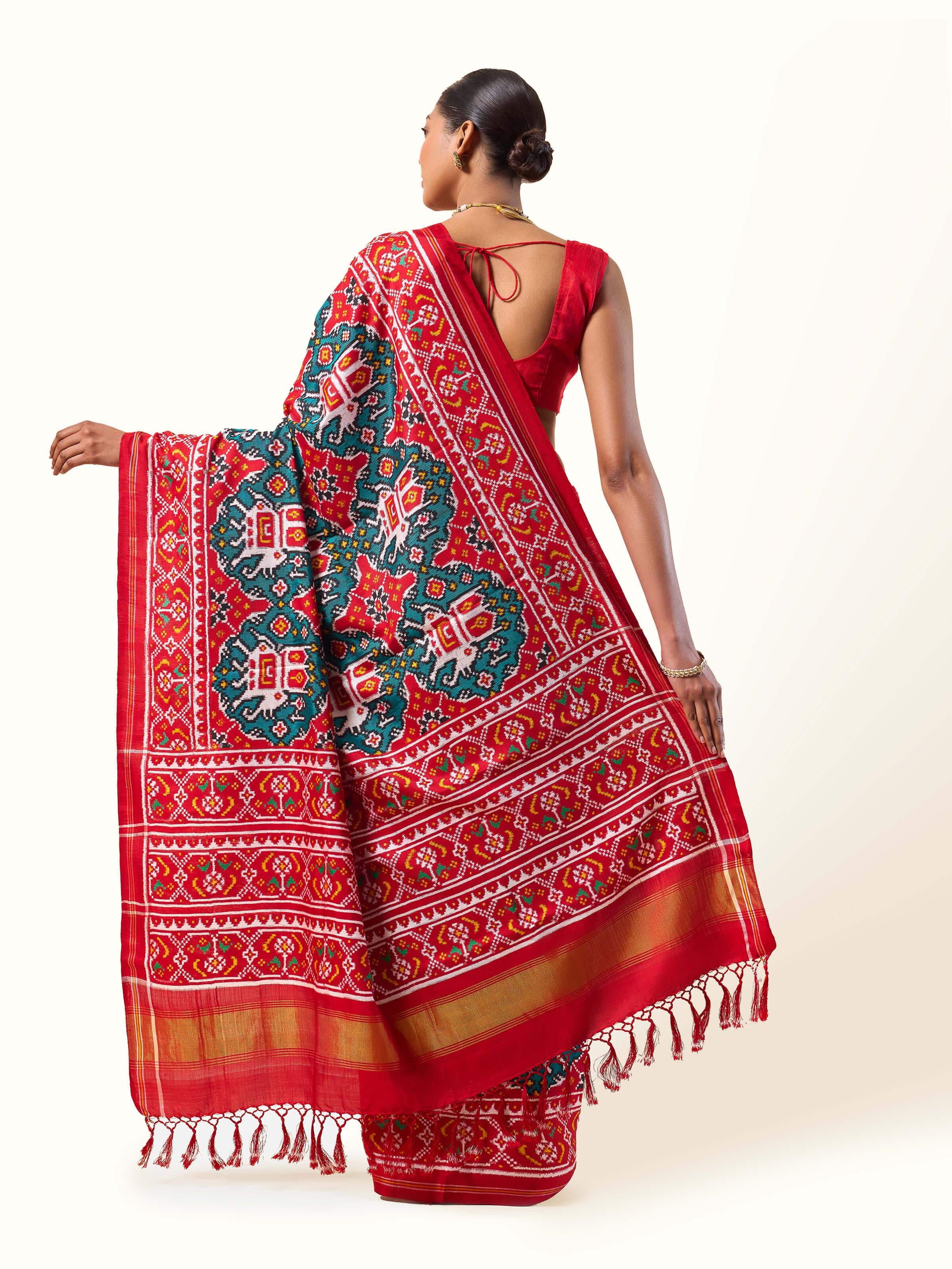 Back view of Green Mulberry Silk Patan Patola Saree showing pleats and border detail.