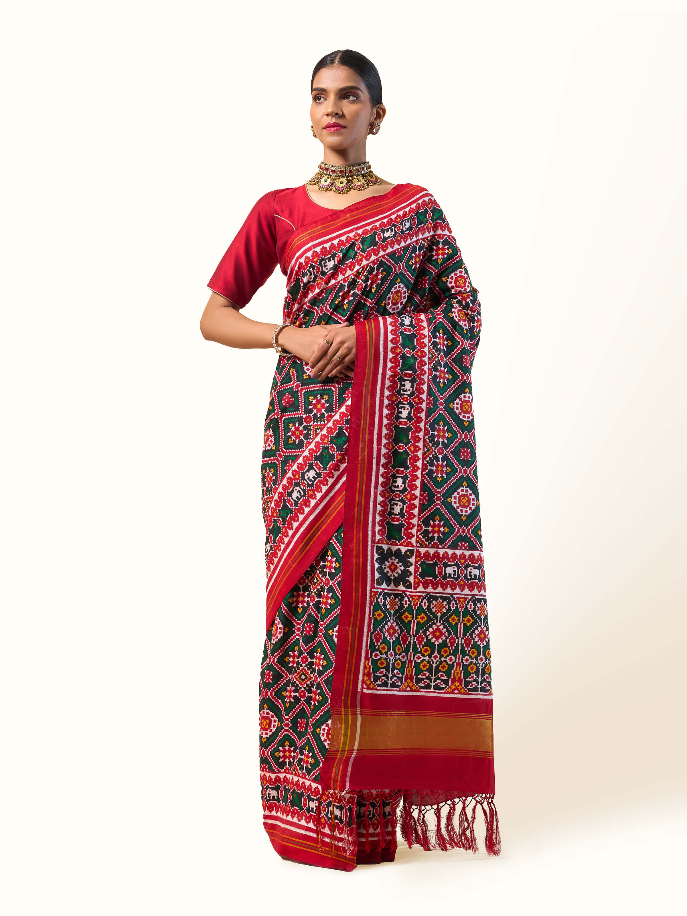 Red mulberry silk Patan Patola saree front view highlighting vibrant colors and traditional Patola motifs