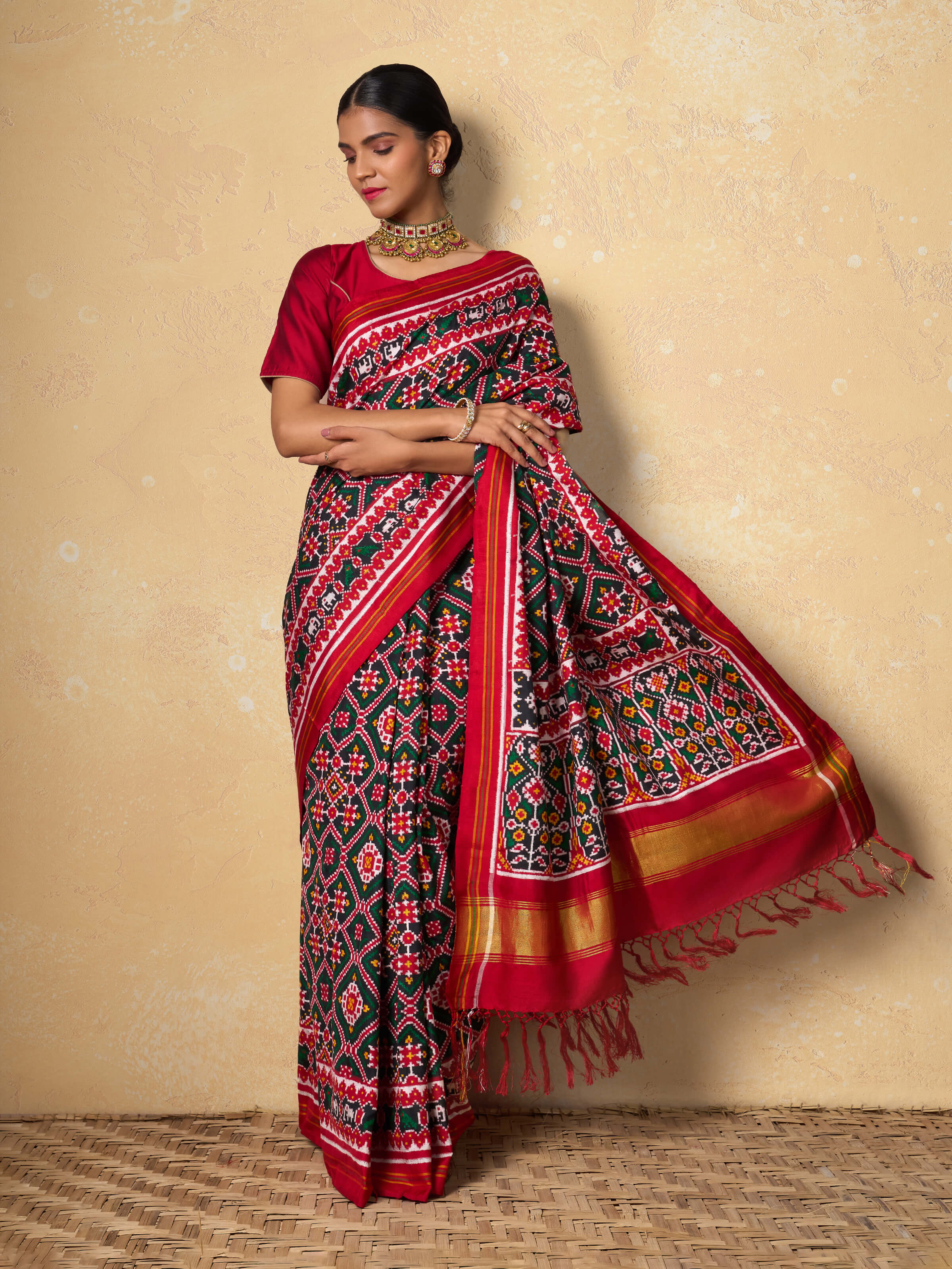 Red mulberry silk Patan Patola saree lifestyle view styled on model showing drape and silk sheen