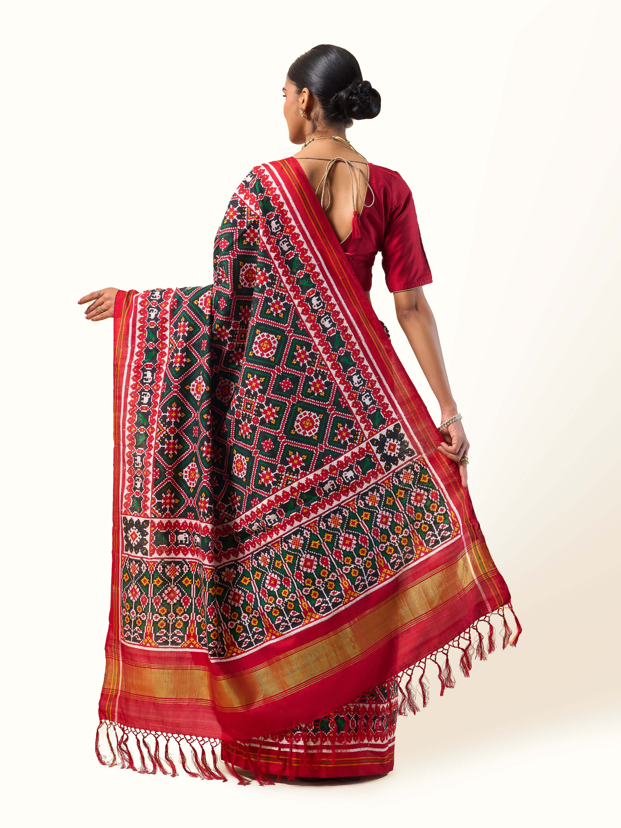Red mulberry silk Patan Patola saree back view showcasing pallu and zari work