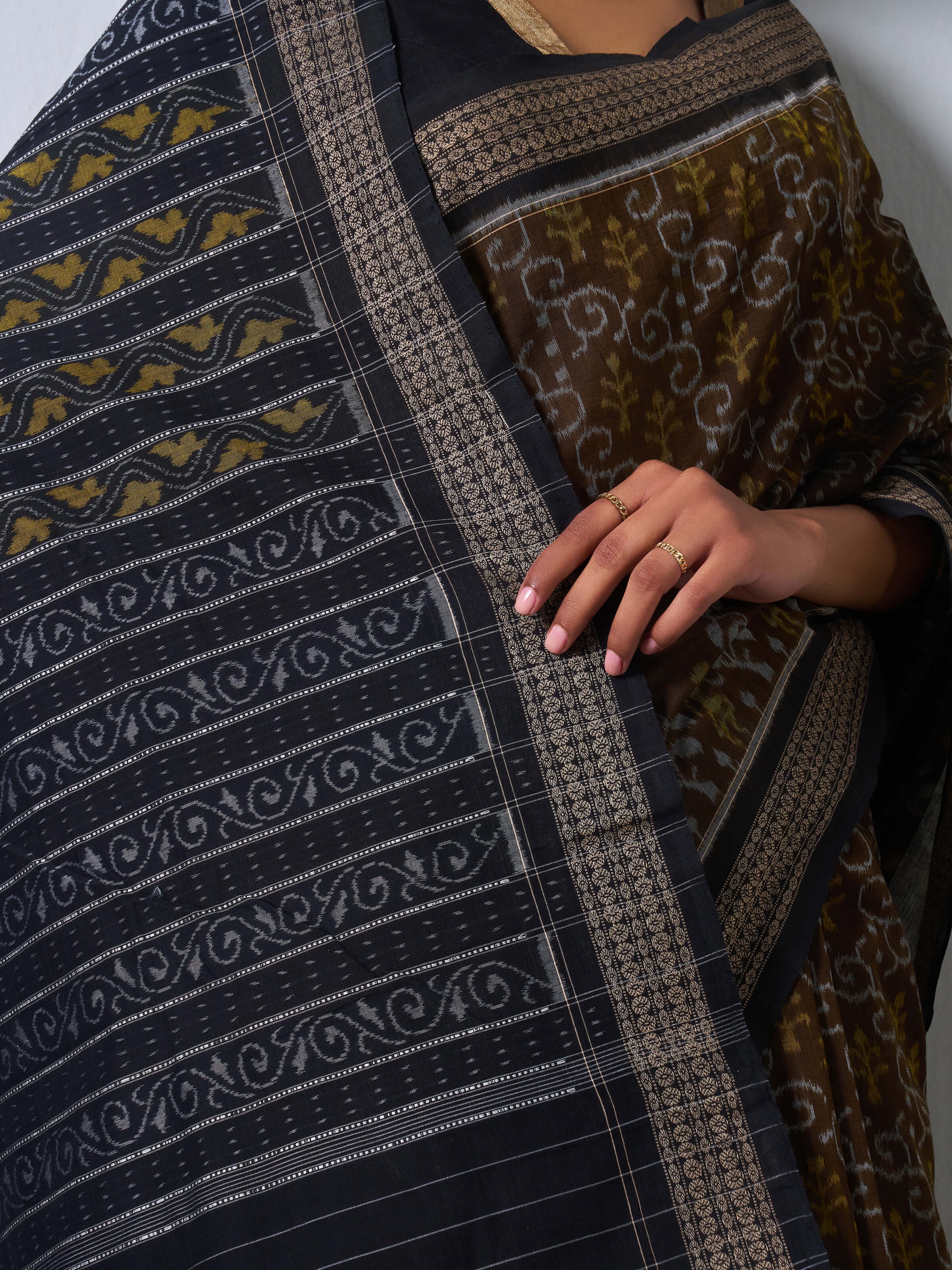 Detail shot of Brown Cotton Bandha Odisha Ikat Saree focusing on Bandha Ikat motifs