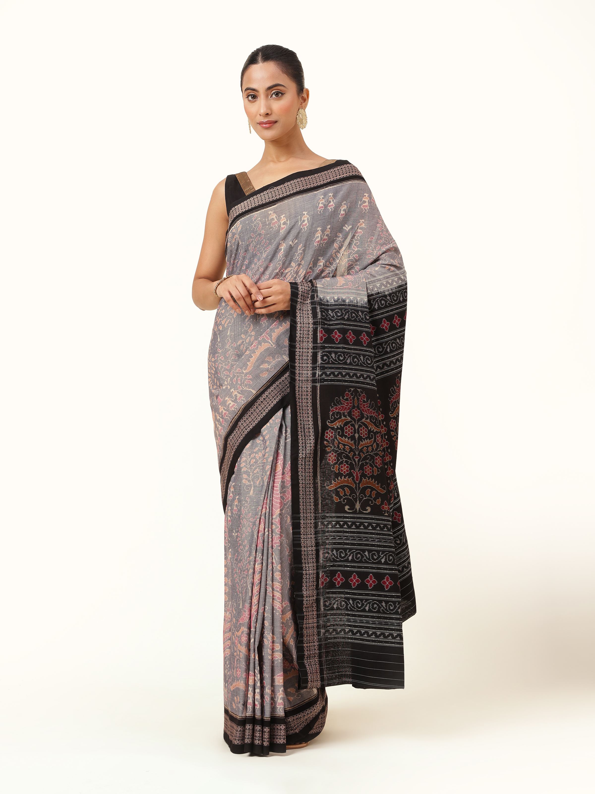 Front view of off-white cotton Bandha Odisha Ikat saree with traditional patterns.