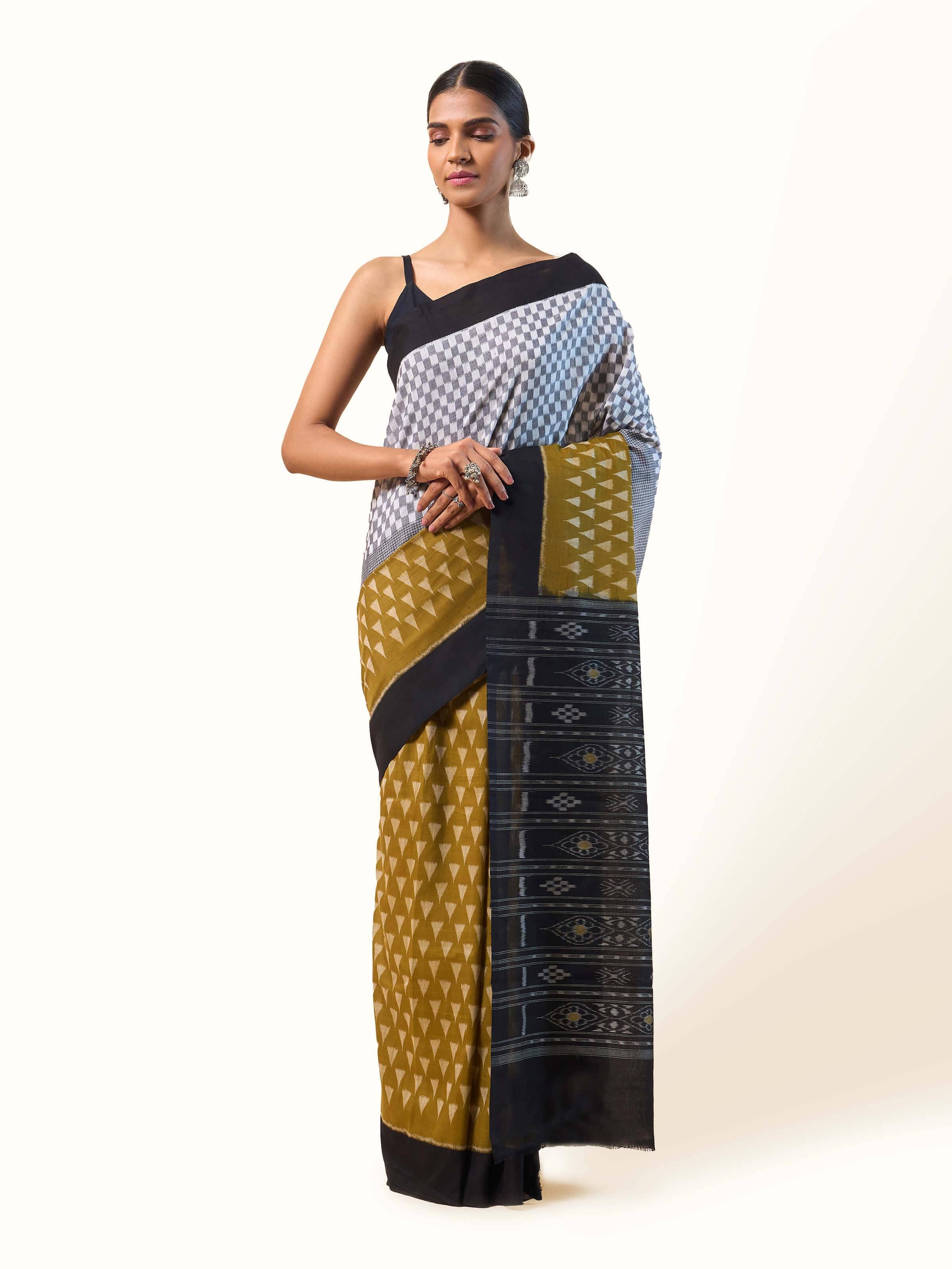 Front view of Mustard Cotton Bandha Odisha Ikat Saree featuring bold bandha ikat patterns on mustard cotton fabric