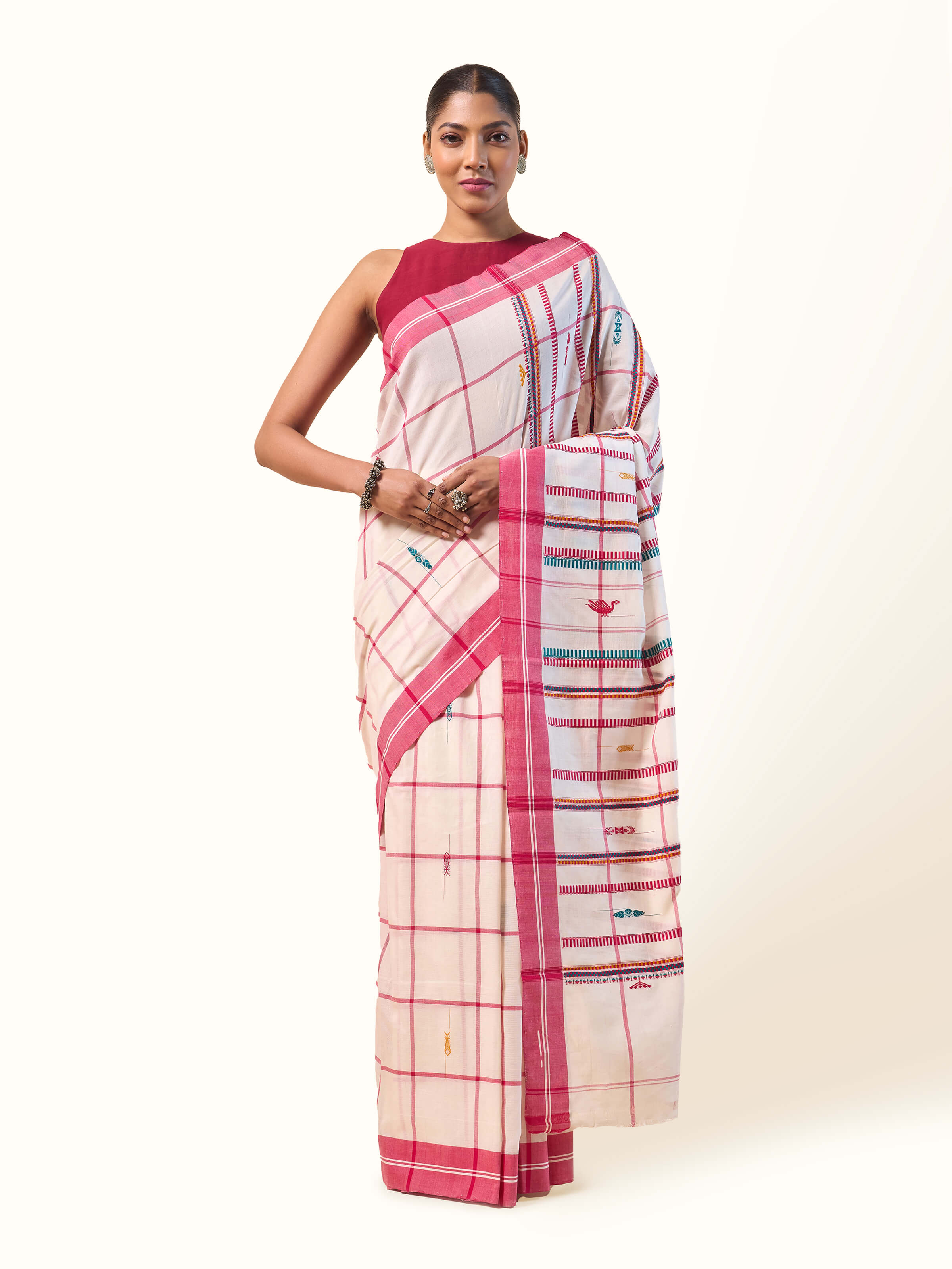 Front view of red cotton extra-weft saree featuring handwoven detailing and traditional design.