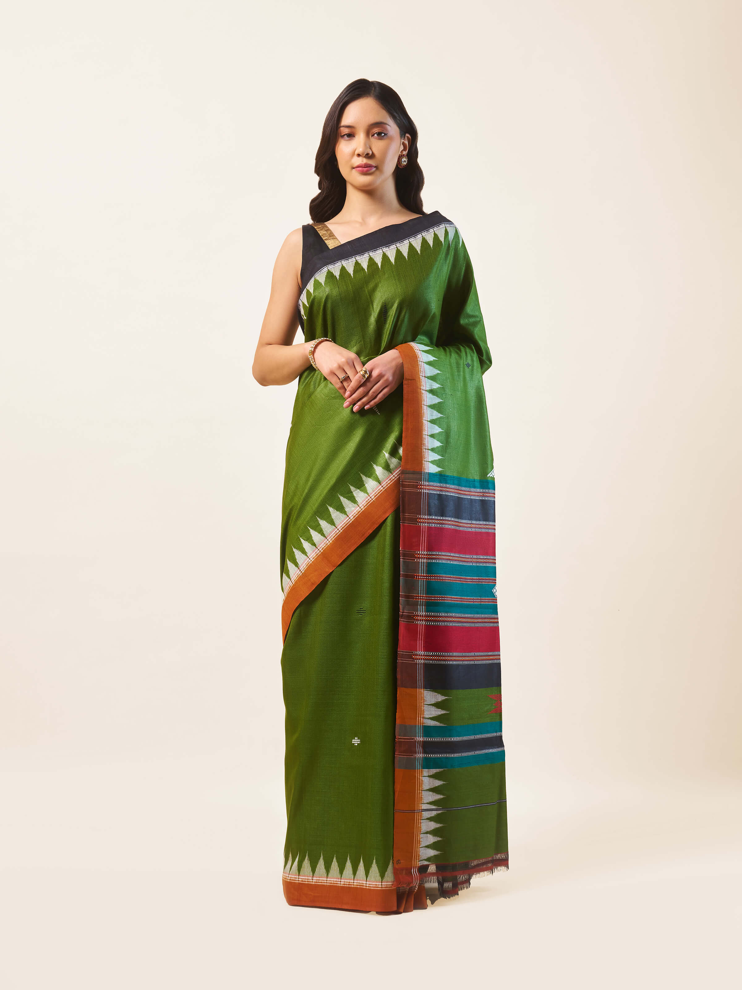 Front view of green Tussar silk Bandha Odisha Ikat saree with striking motifs.