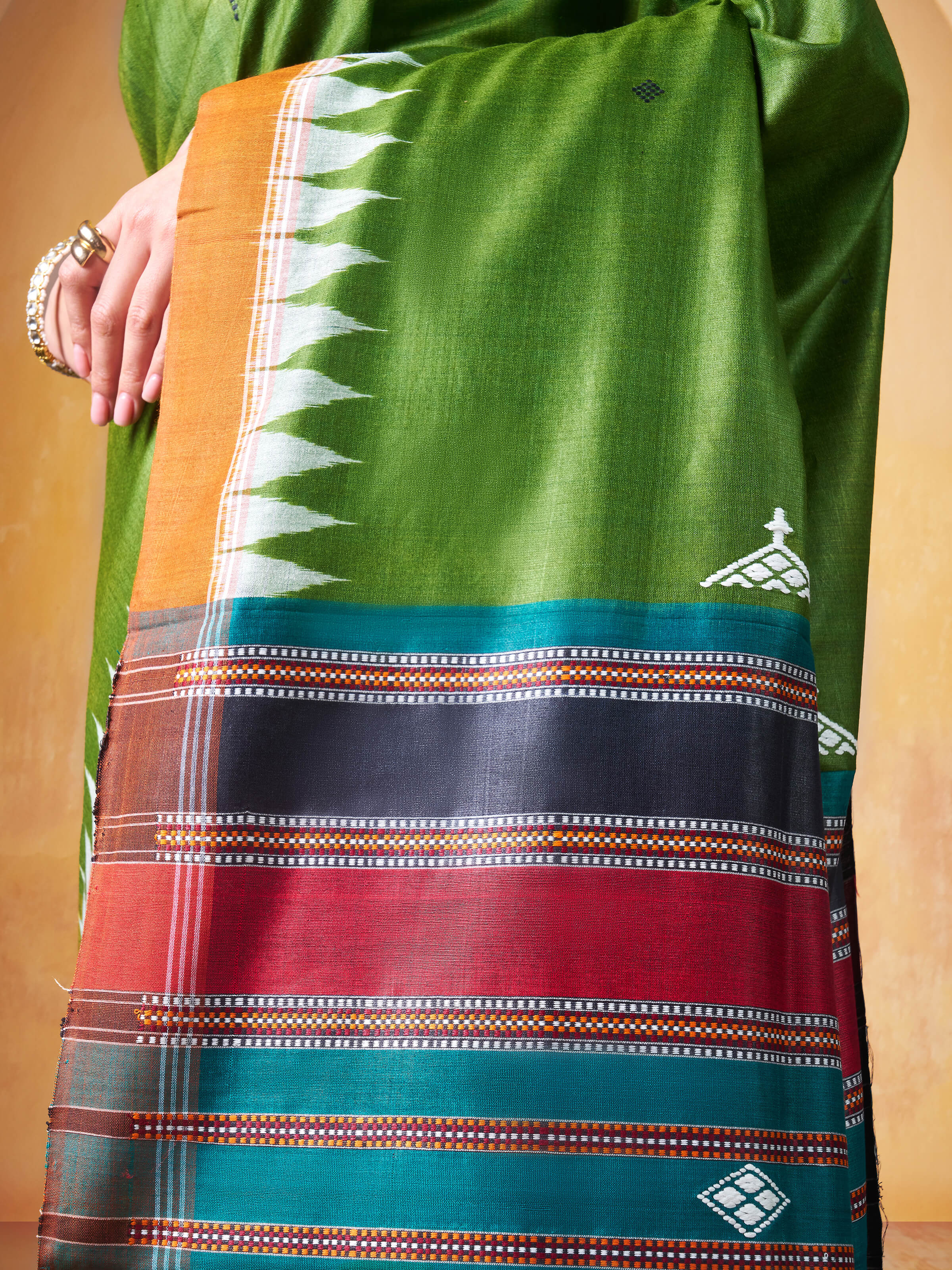 Detail shot of pallu displaying intricate Ikat weaving on Tussar silk.