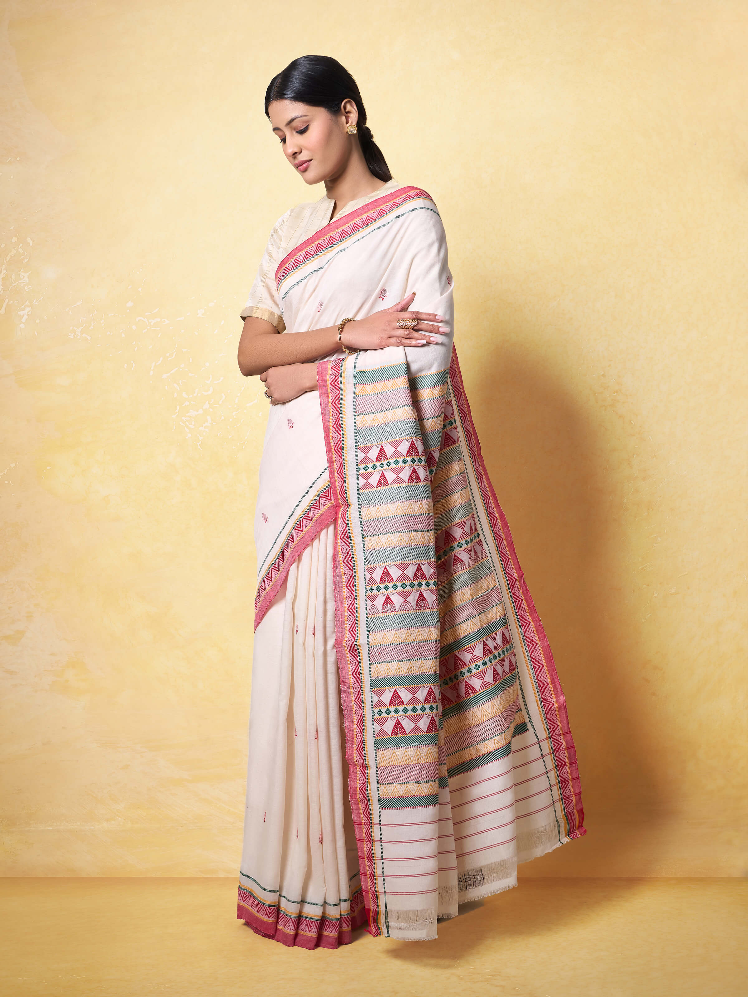 Lifestyle view of Off-white Cotton Dongaria Saree draped elegantly on model.
