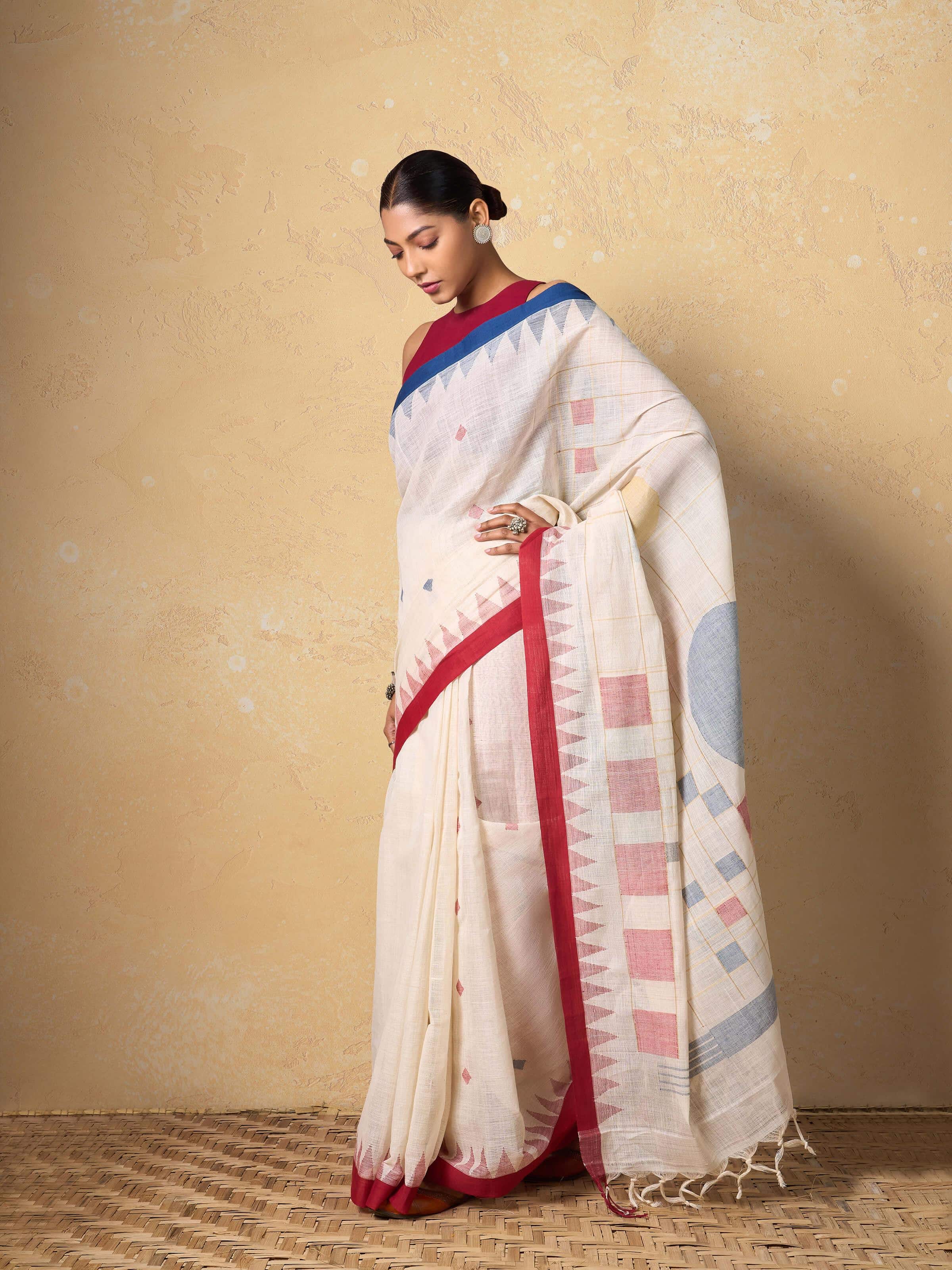 Lifestyle image of model draped in White Cotton Jamdani Saree highlighting lightweight fabric and embroidery