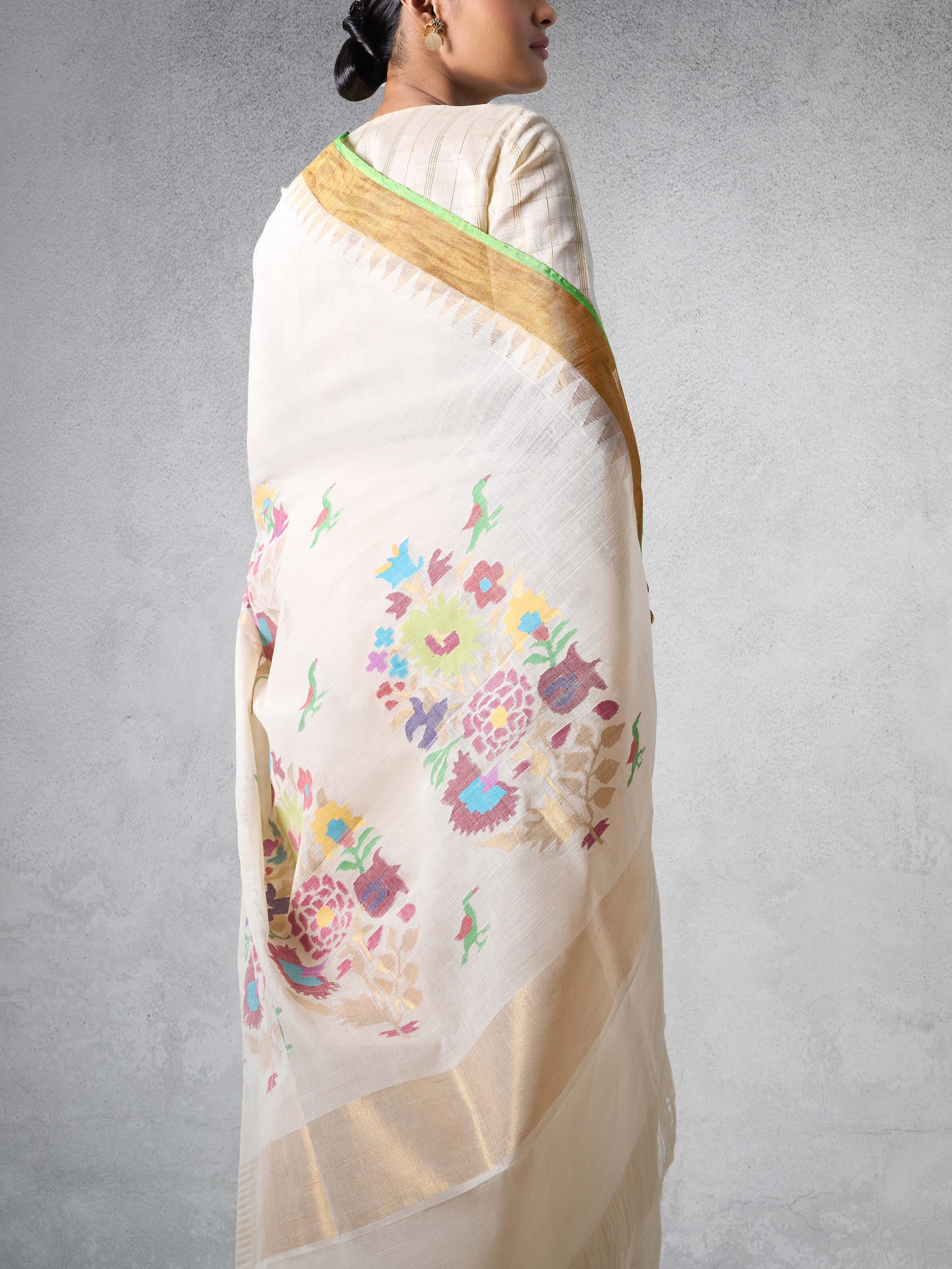 Side angled view of the saree emphasizing its lightness and graceful appeal.
