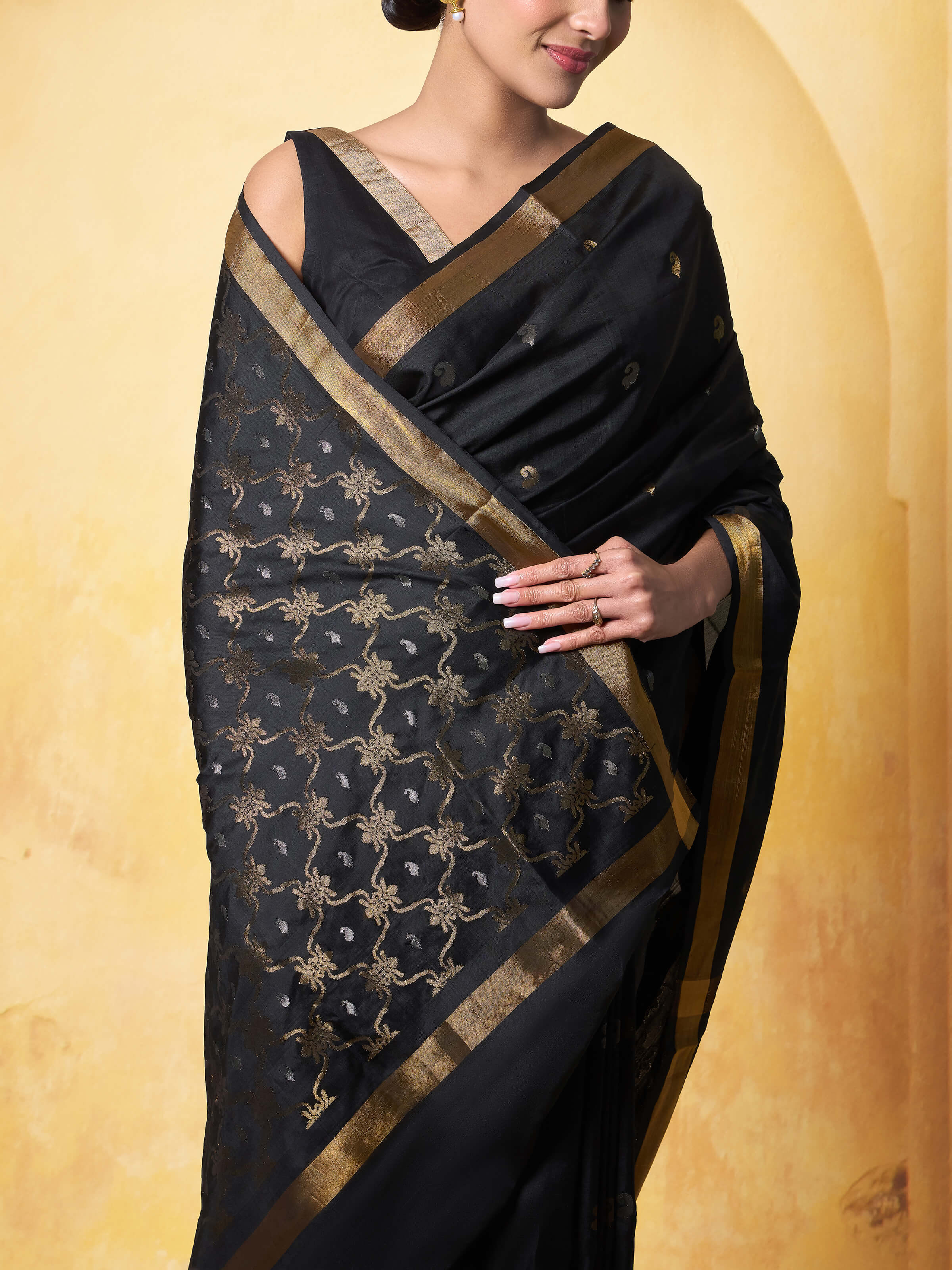 Detail shot of black mulberry silk Uppada Jamdani saree highlighting Jamdani weaving