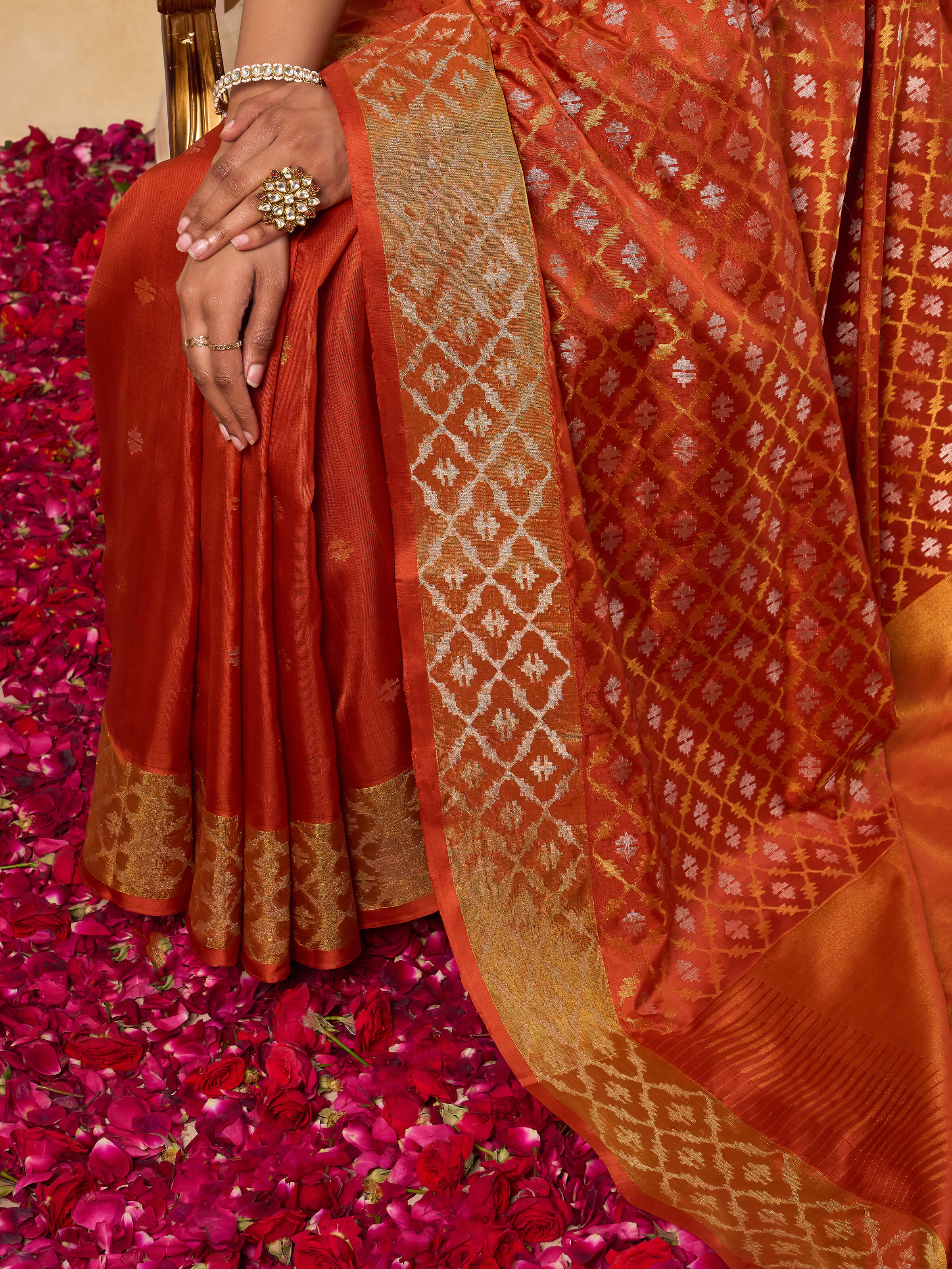 Detail shot of intricate Jamdani motifs on rust Uppada cotton silk saree