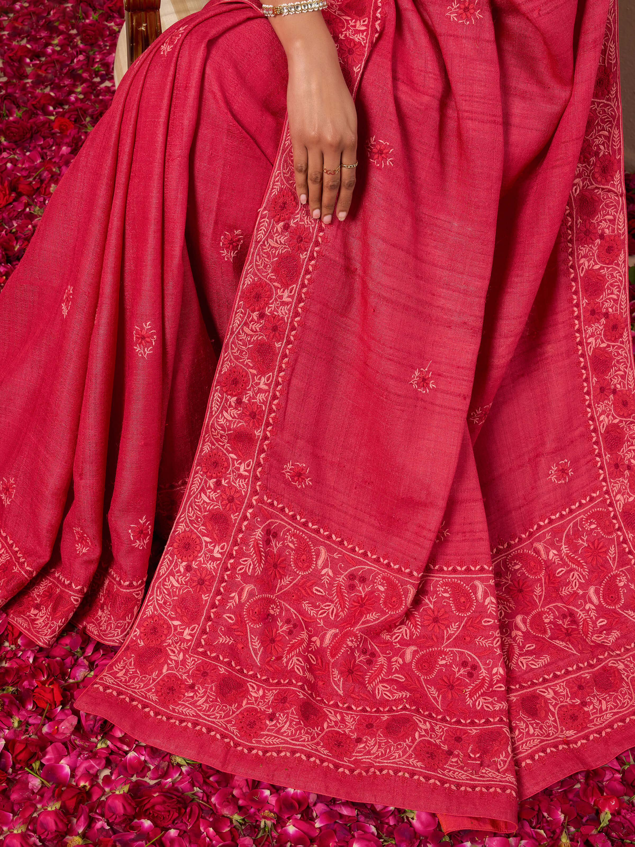 Draped side view emphasizing the richness and flow of the saree