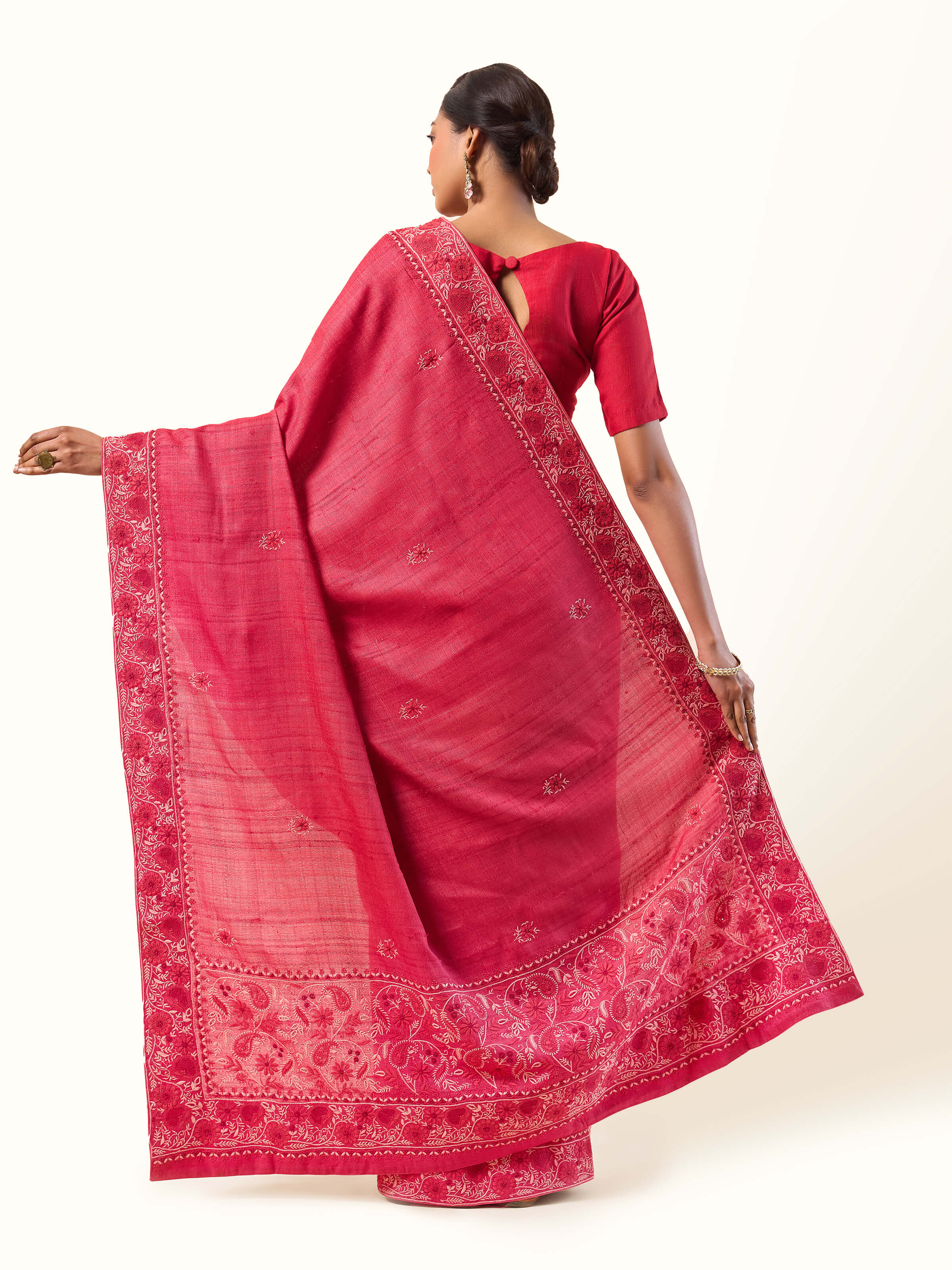 Back view showing the complete look with deep red hues and fine detailing