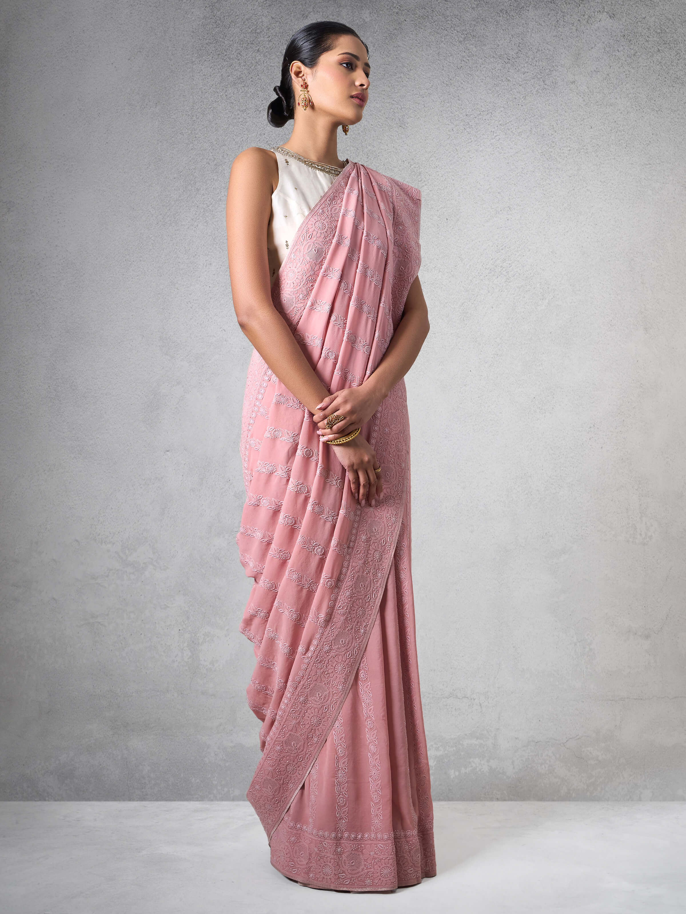 Lifestyle view of Pink Silk Georgette Chikankari Saree worn gracefully with minimal accessories.