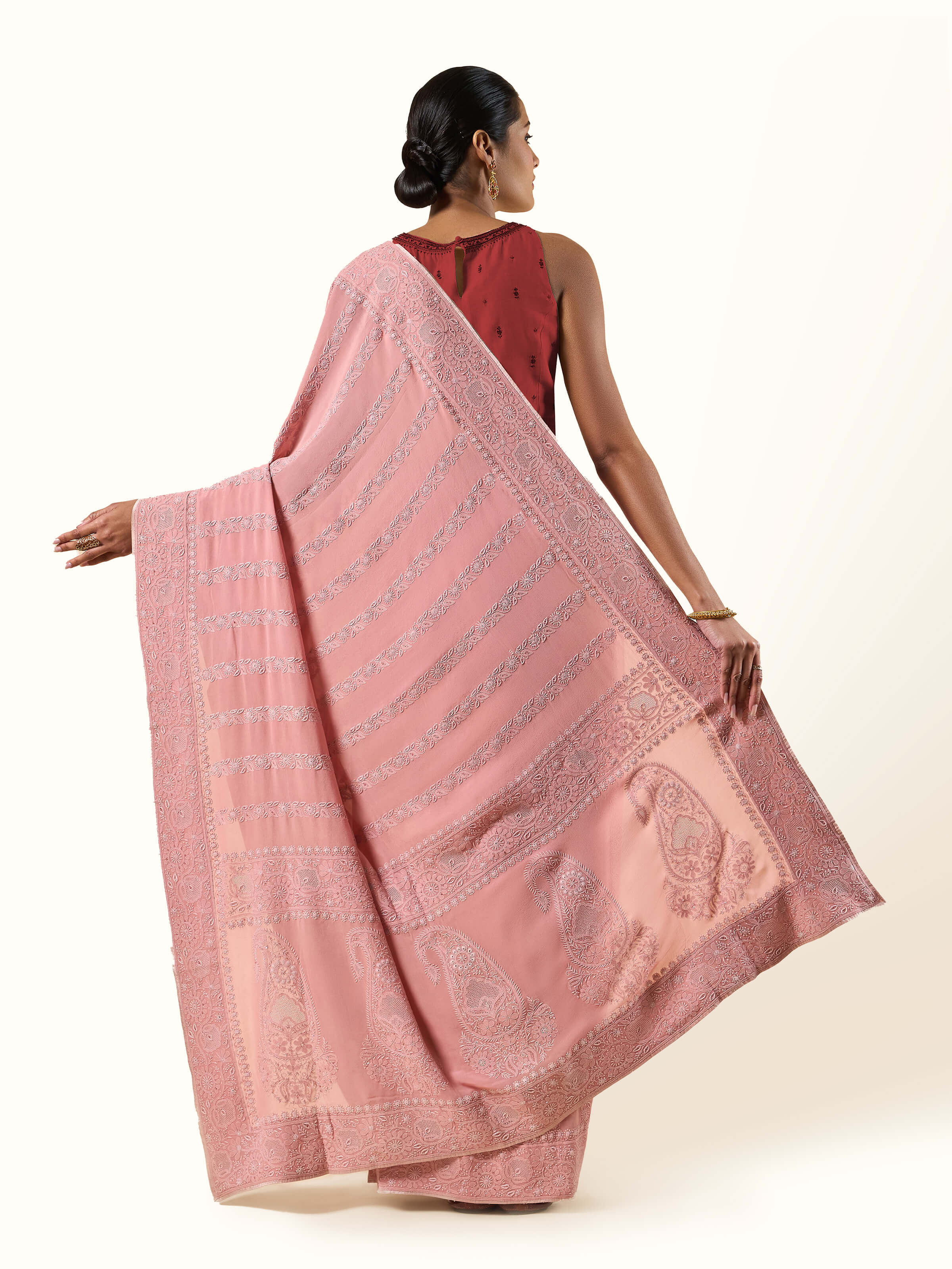 Back view of Pink Silk Georgette Chikankari Saree showing embroidery and fabric flow.