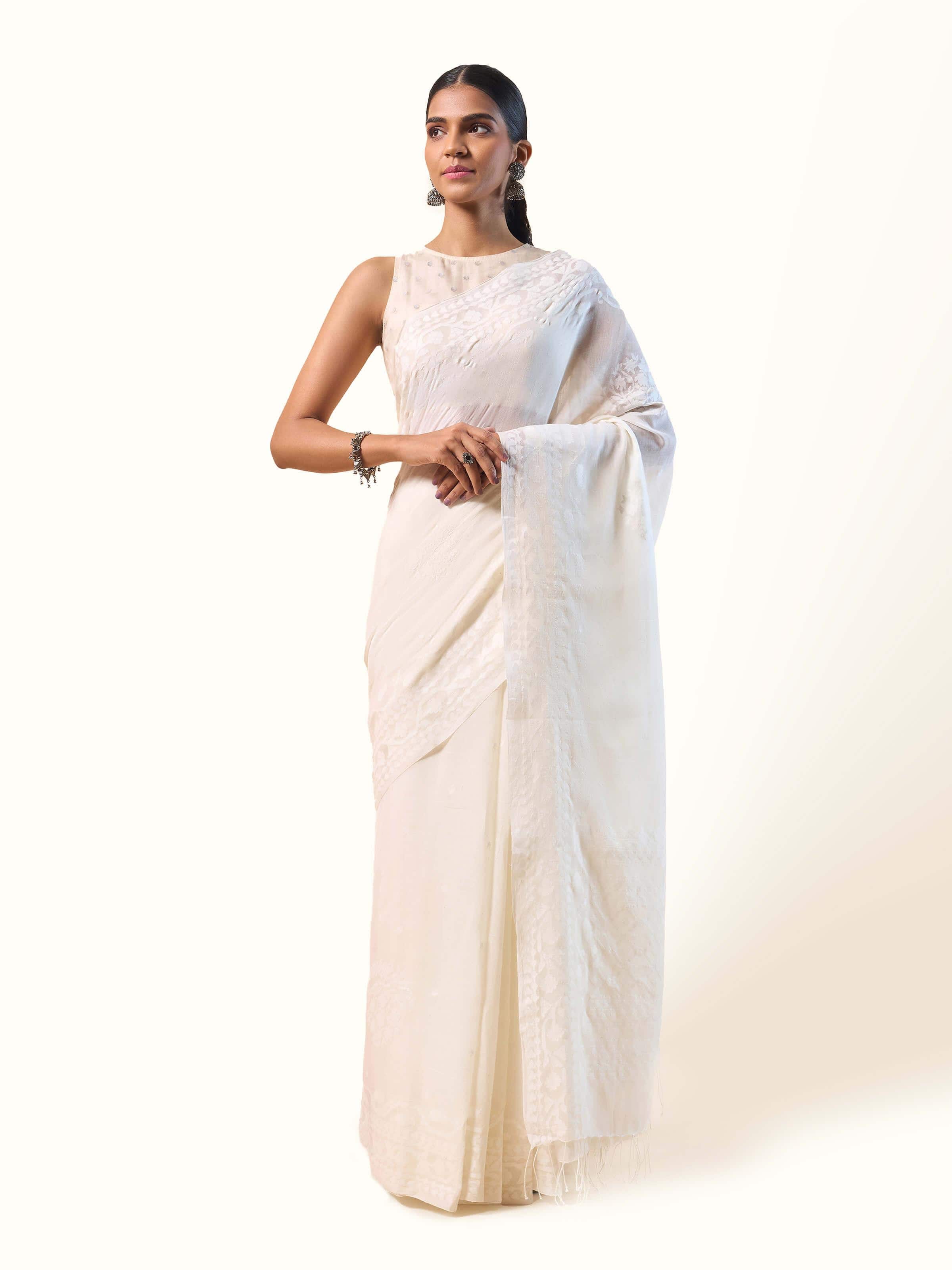 Front view of off-white cotton Jamdani saree featuring subtle motifs