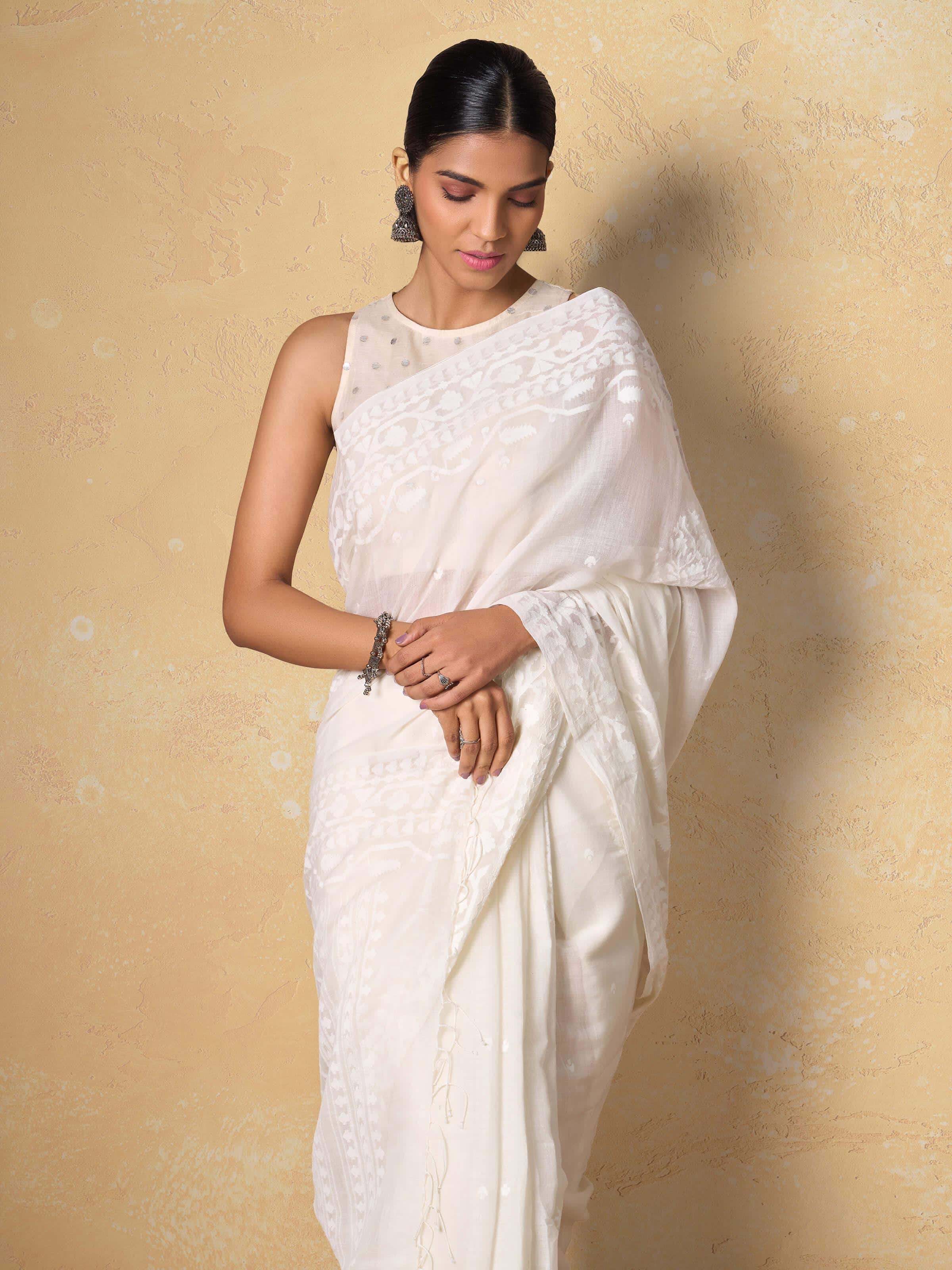 Detail shot of off-white Jamdani saree showing texture and weave