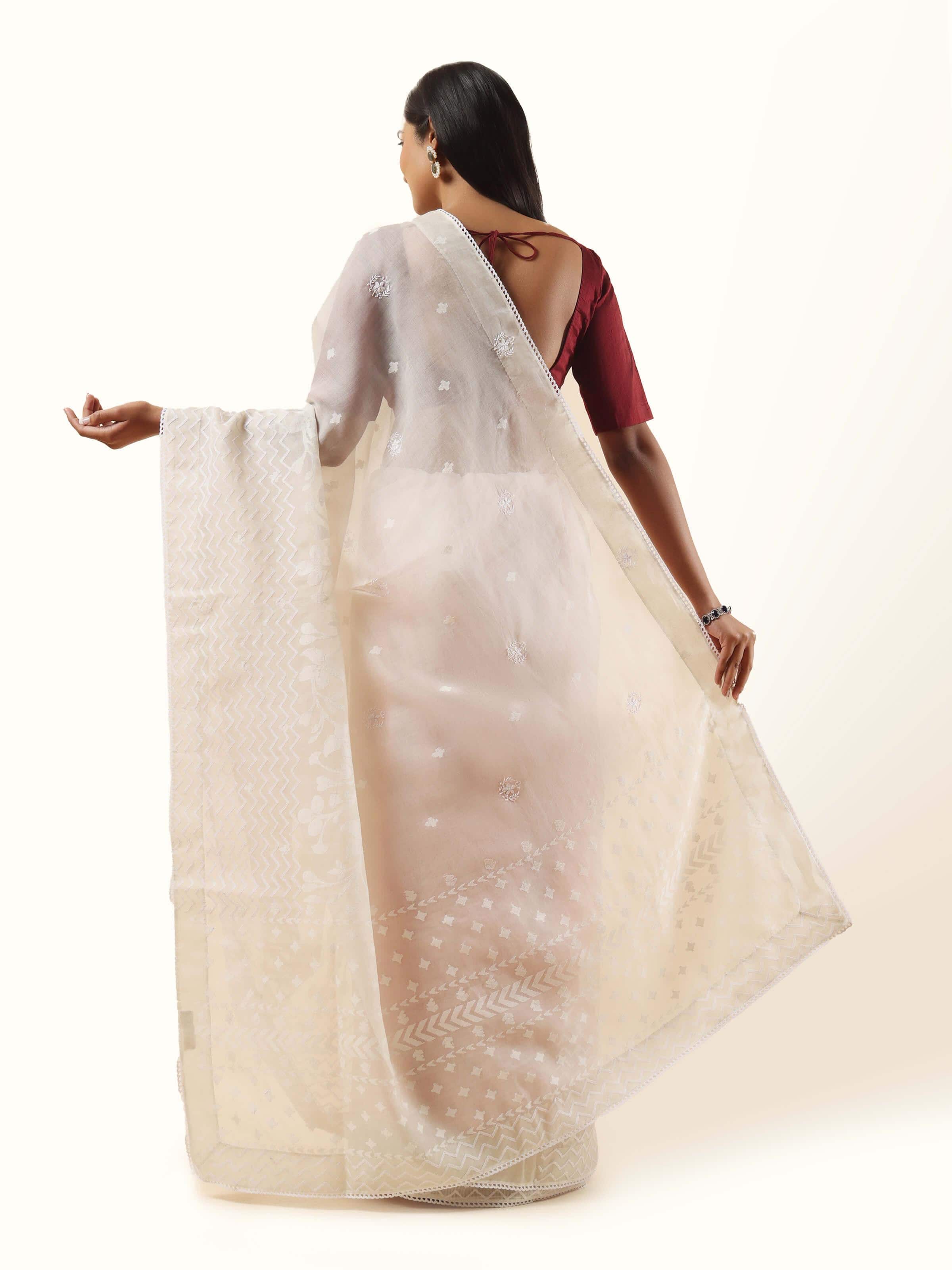 Back view offering a full look at the sophisticated and graceful finish of this classic saree.
