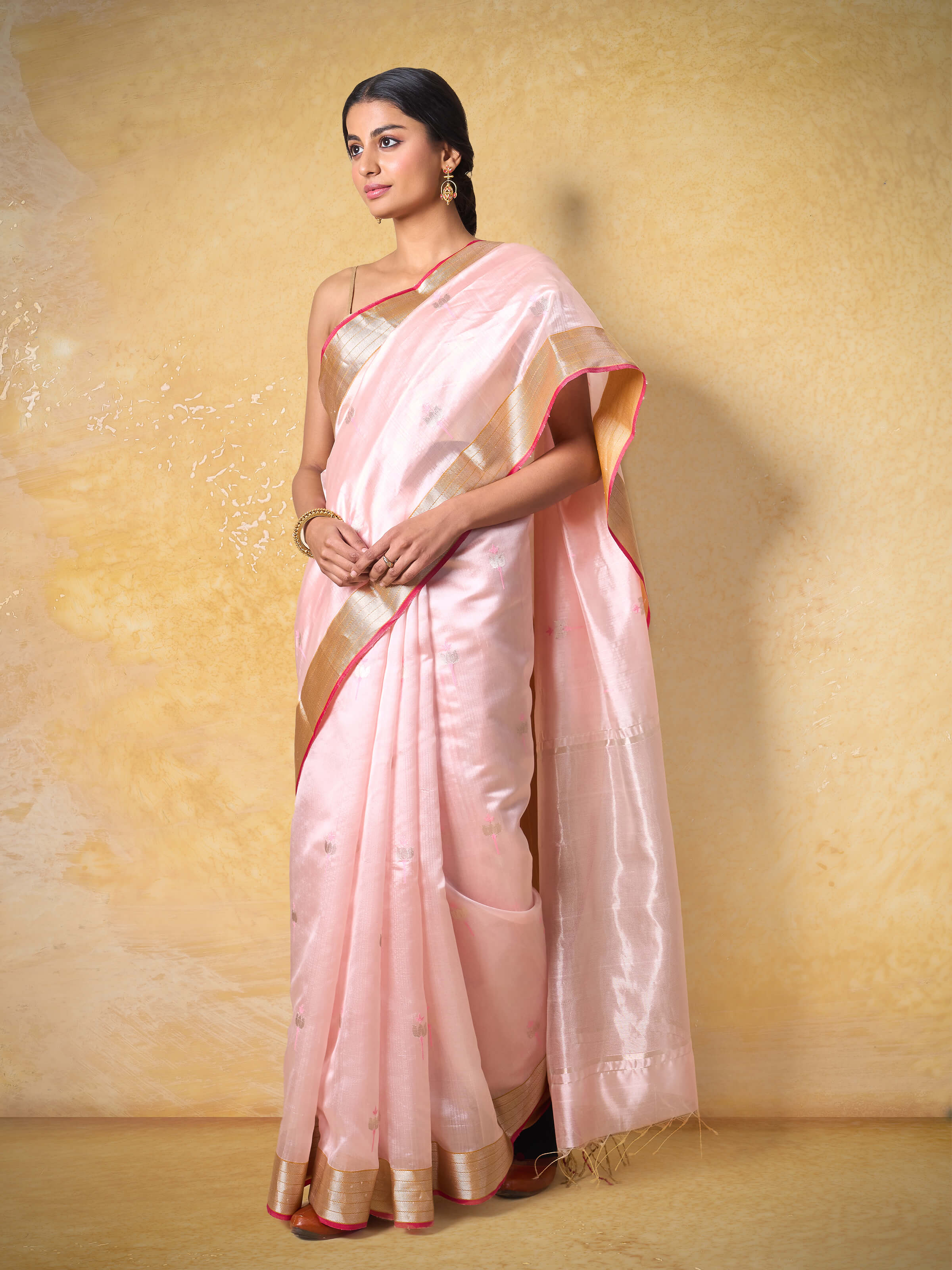 Lifestyle image showcasing the graceful drape and festive appeal of Chanderi fabric.