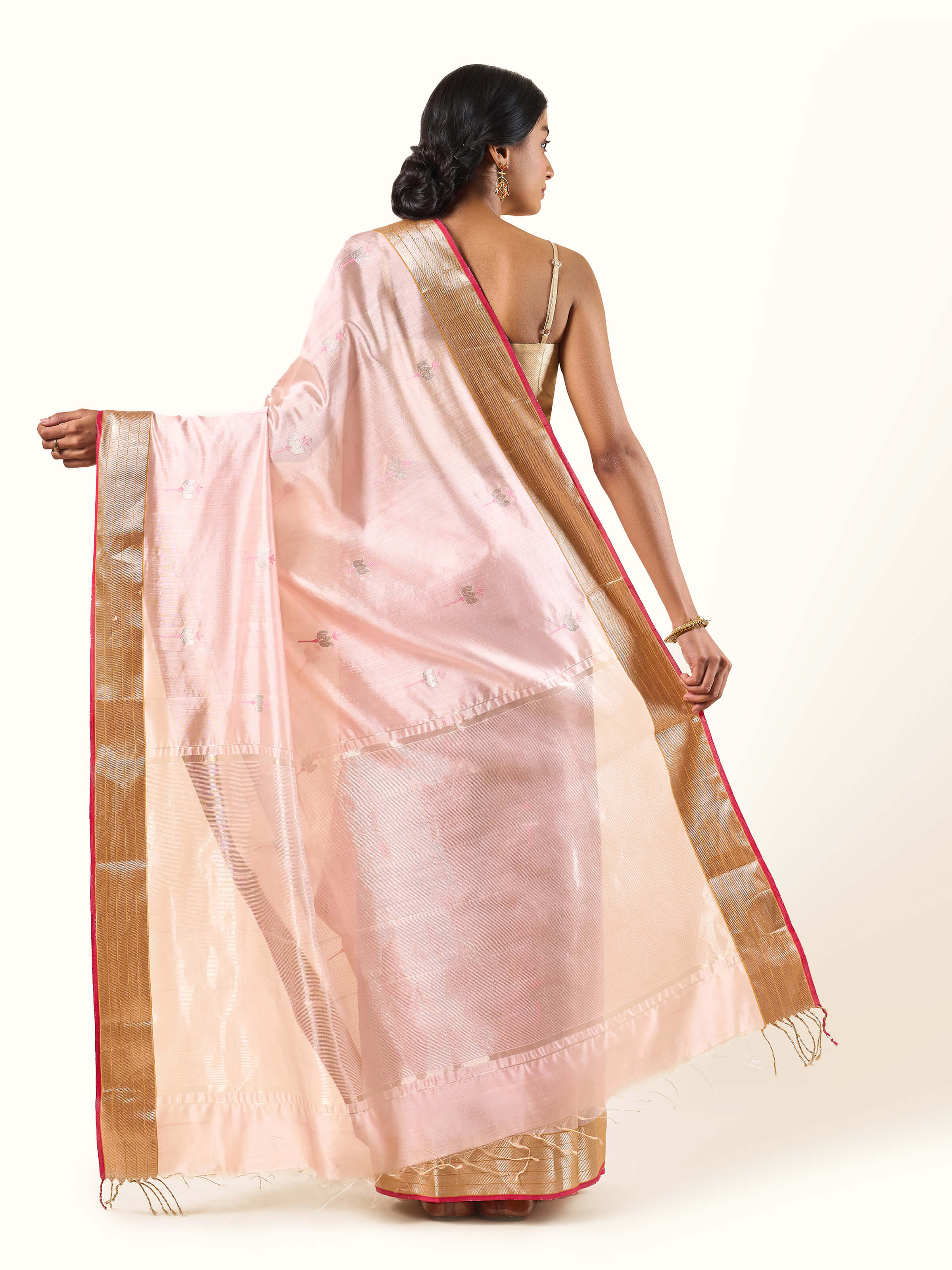 Back view capturing the elegant weave and luminous pink tone.