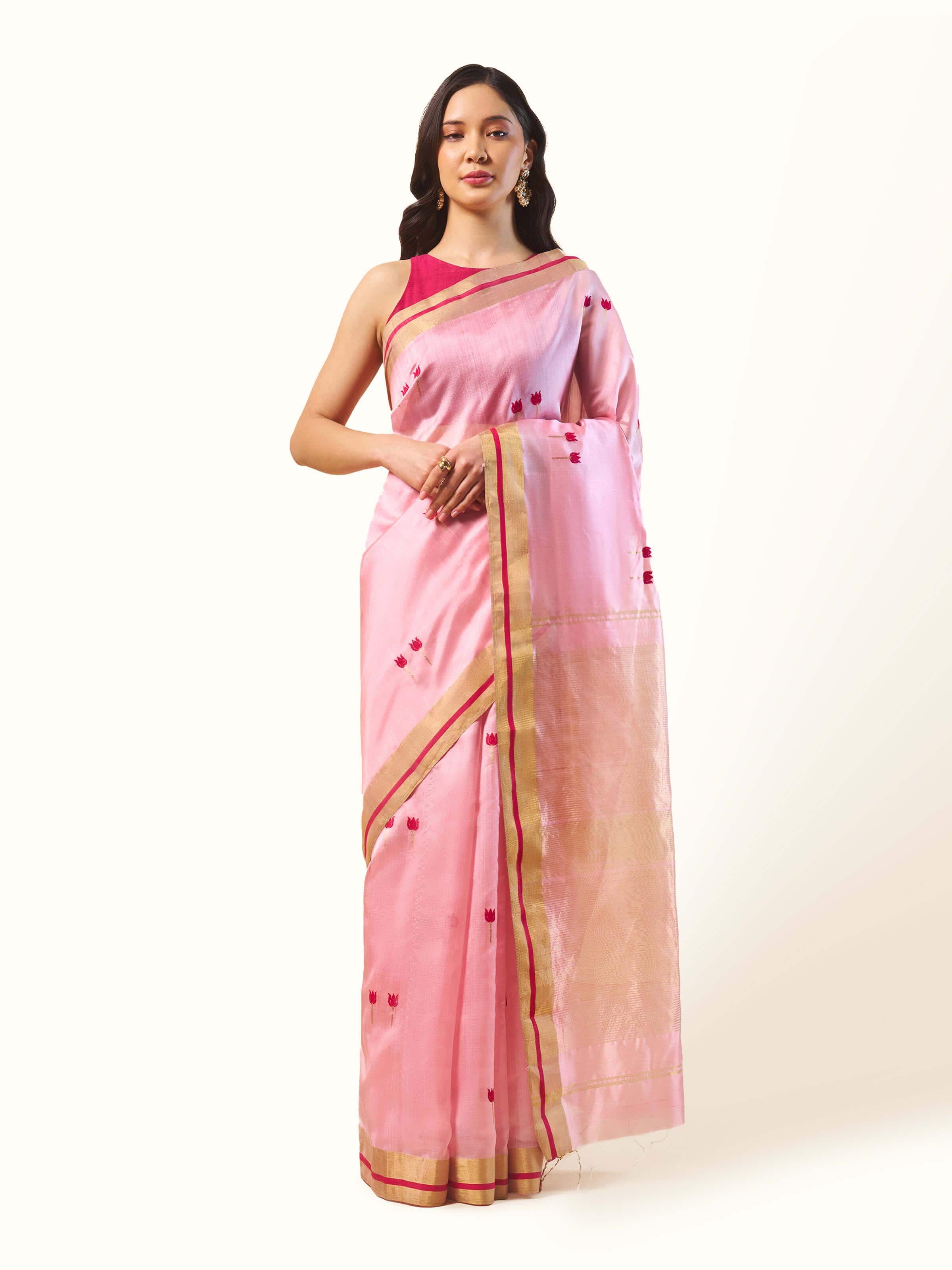 Front view of cream pink cotton silk Chanderi saree with subtle zari border and soft texture.
