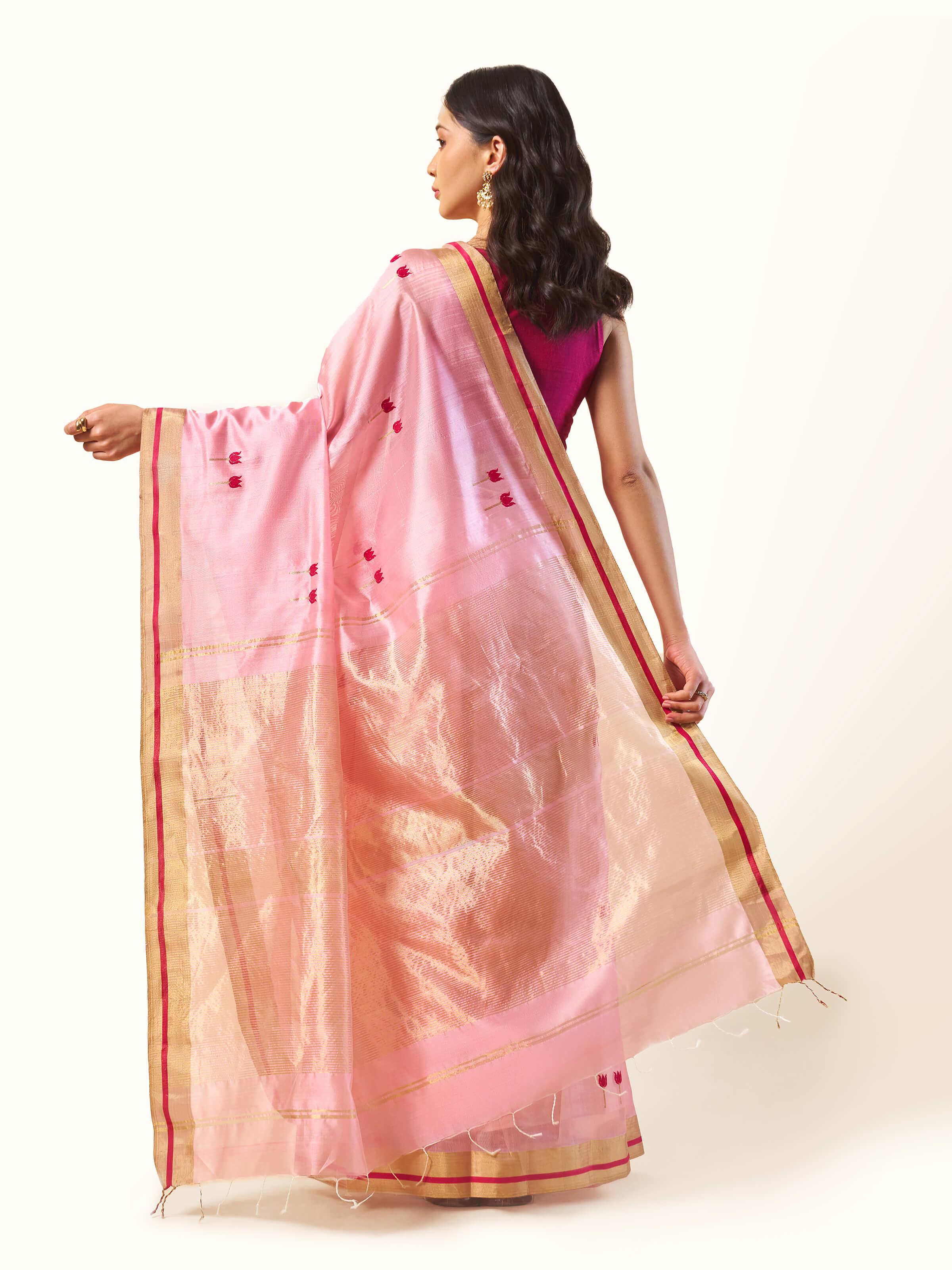 Back view of cream pink cotton silk Chanderi saree displaying full length and smooth finish.