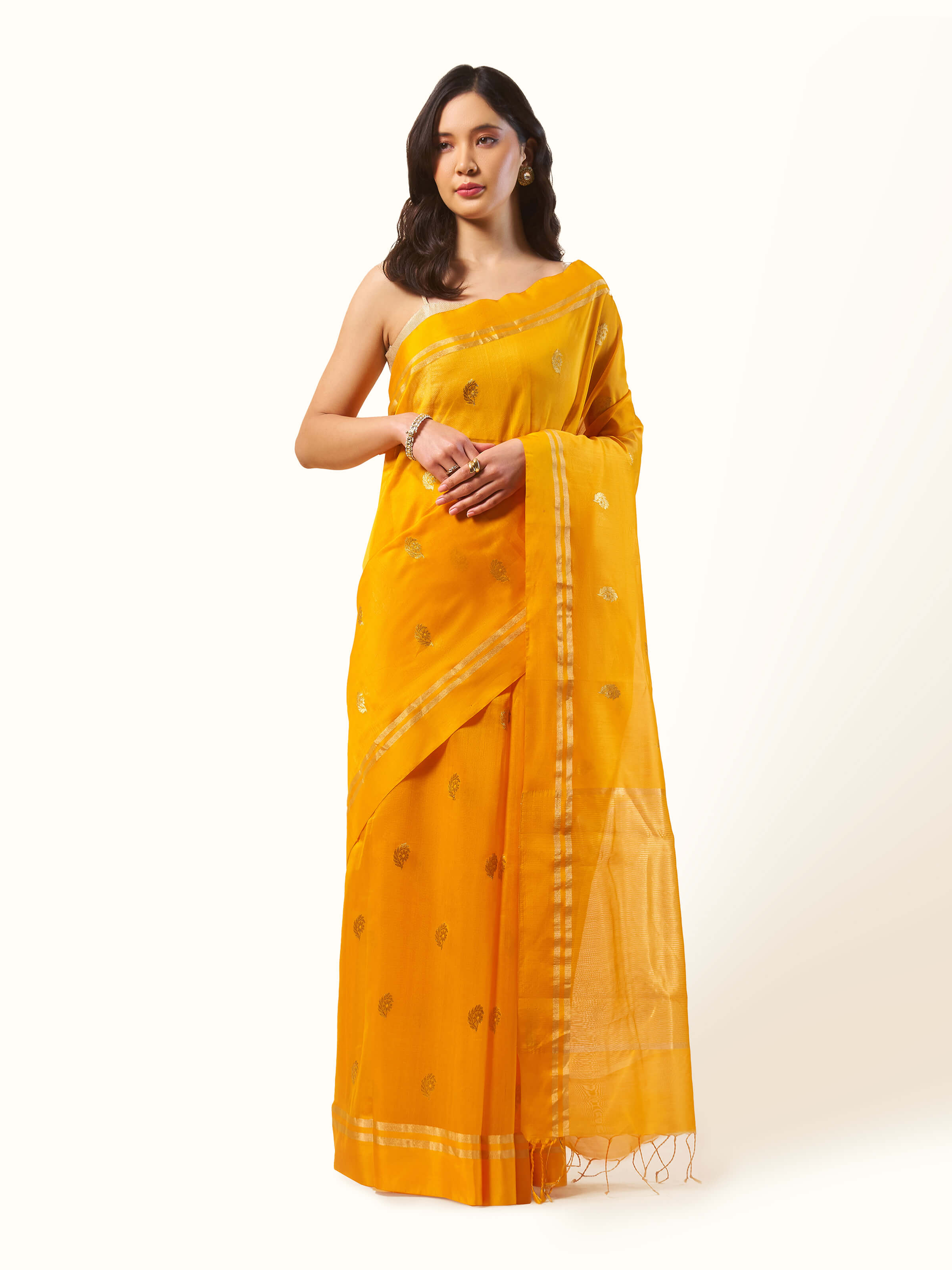 Front view of mango mulberry silk cotton Chanderi saree with subtle sheen and traditional weave