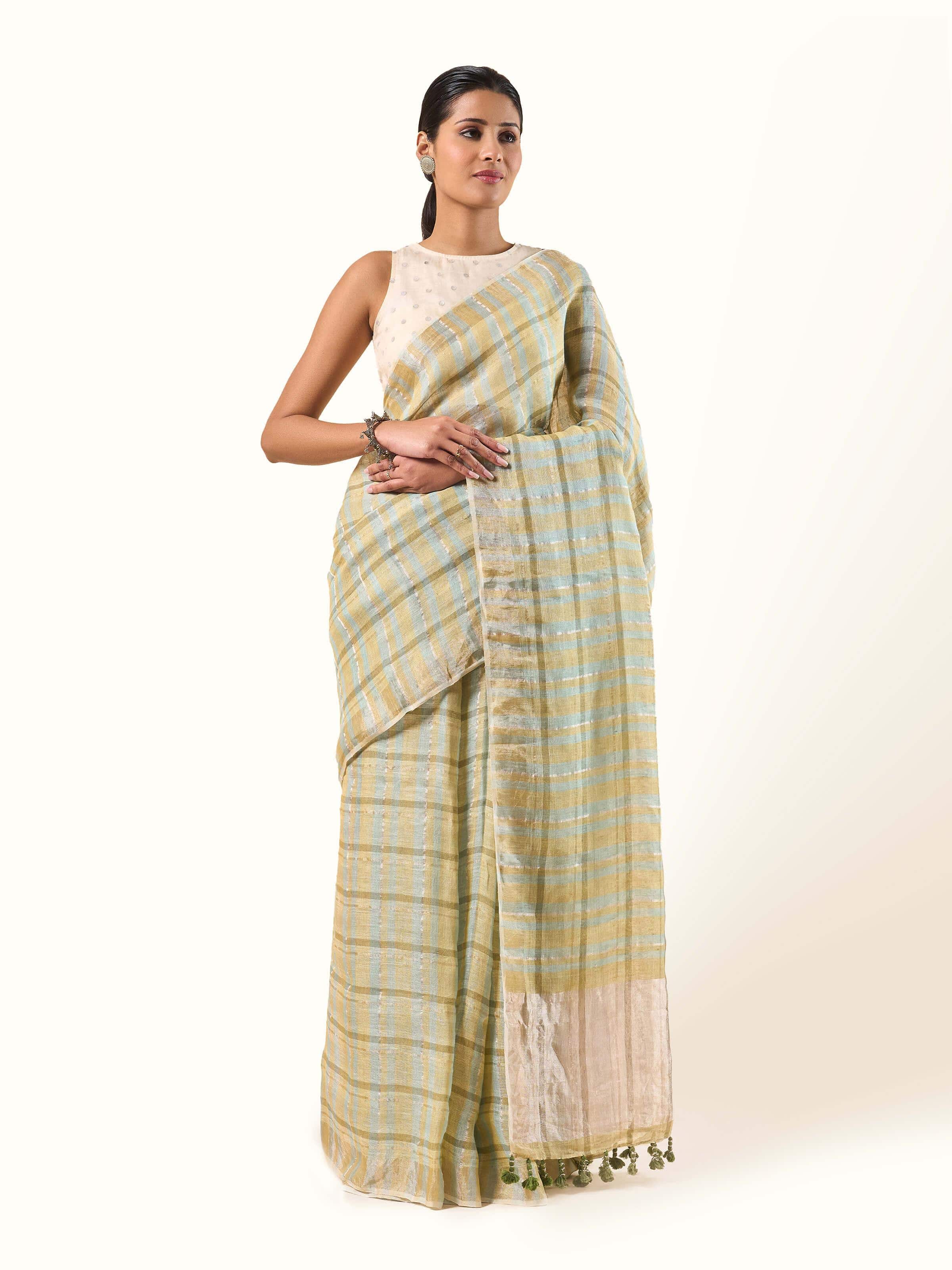 Front view of Light Olive Linen Zari Saree featuring subtle olive linen fabric accented with elegant zari border