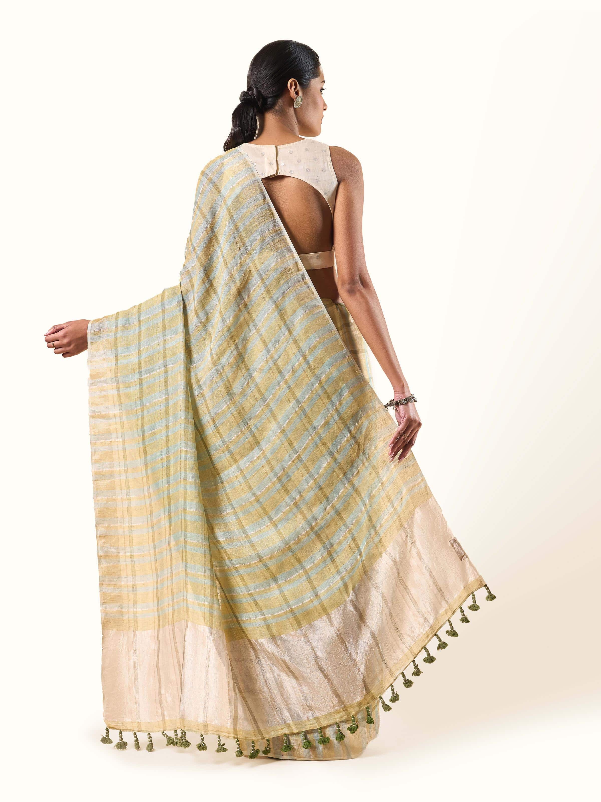 Close-up detail of zari thread work and linen texture on Light Olive Saree