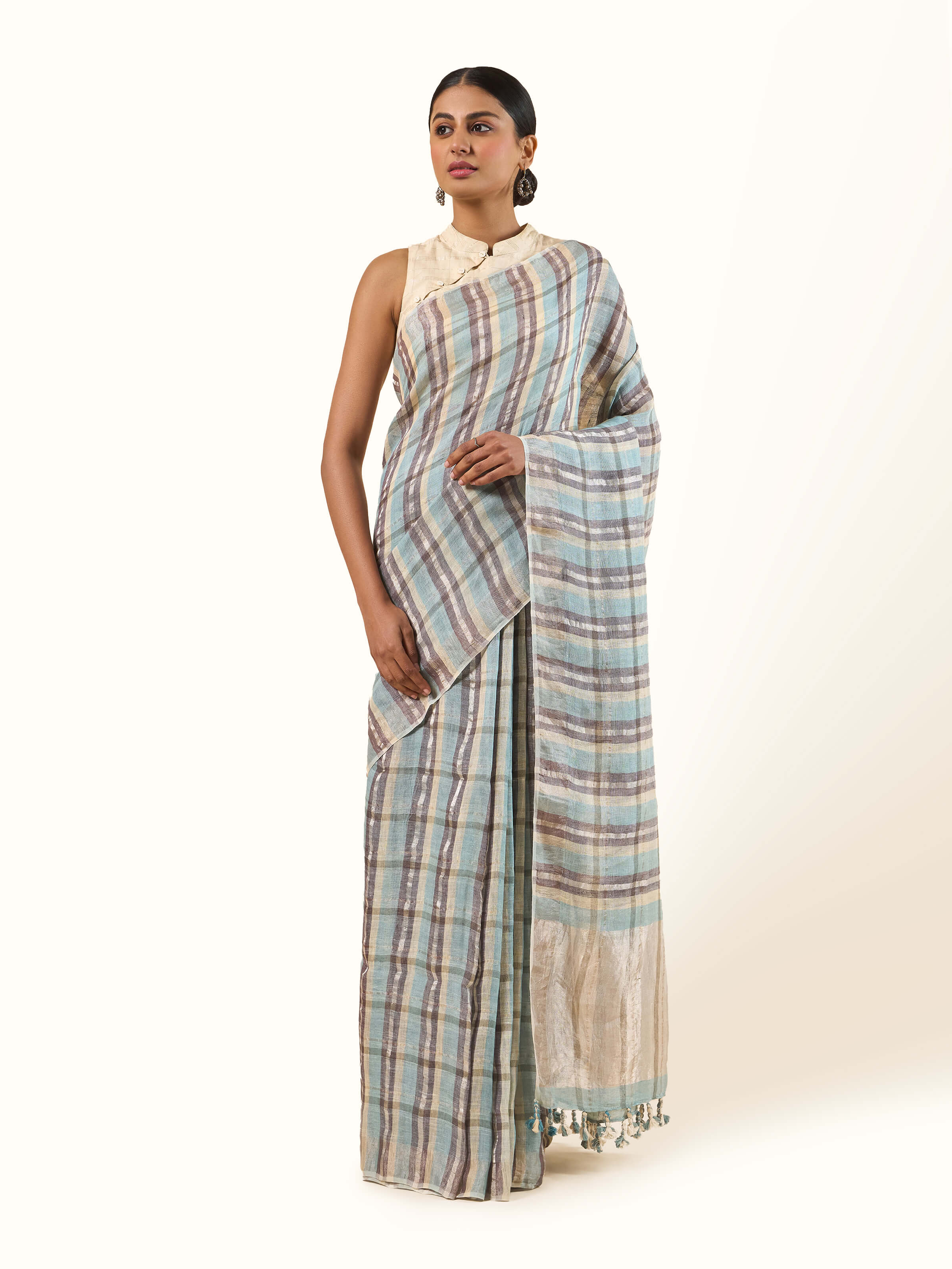 Front view of grey linen Zari saree featuring a subtle metallic sheen and elegant woven detailing.