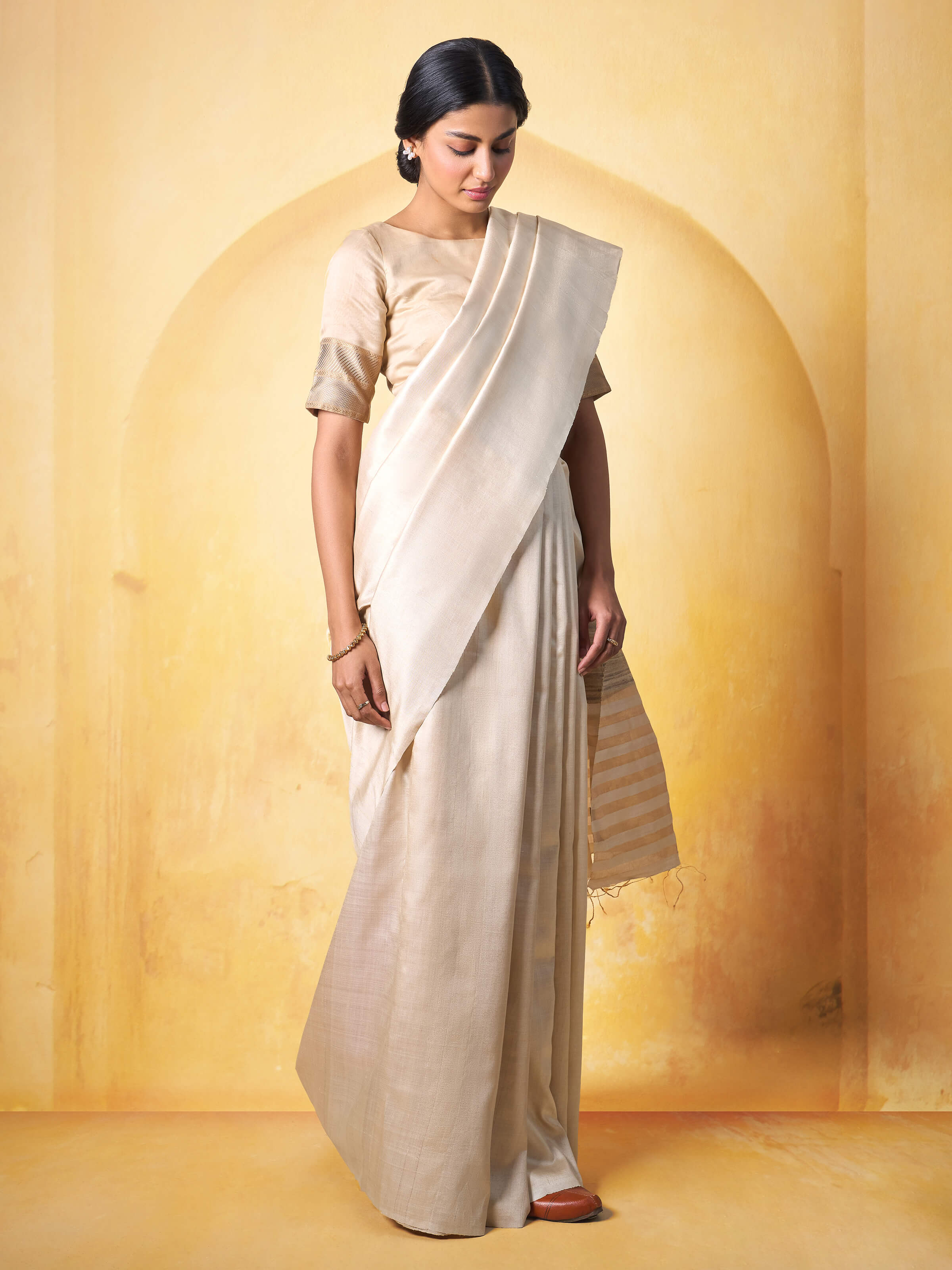 Lifestyle image displaying the elegant drape and traditional styling of the saree