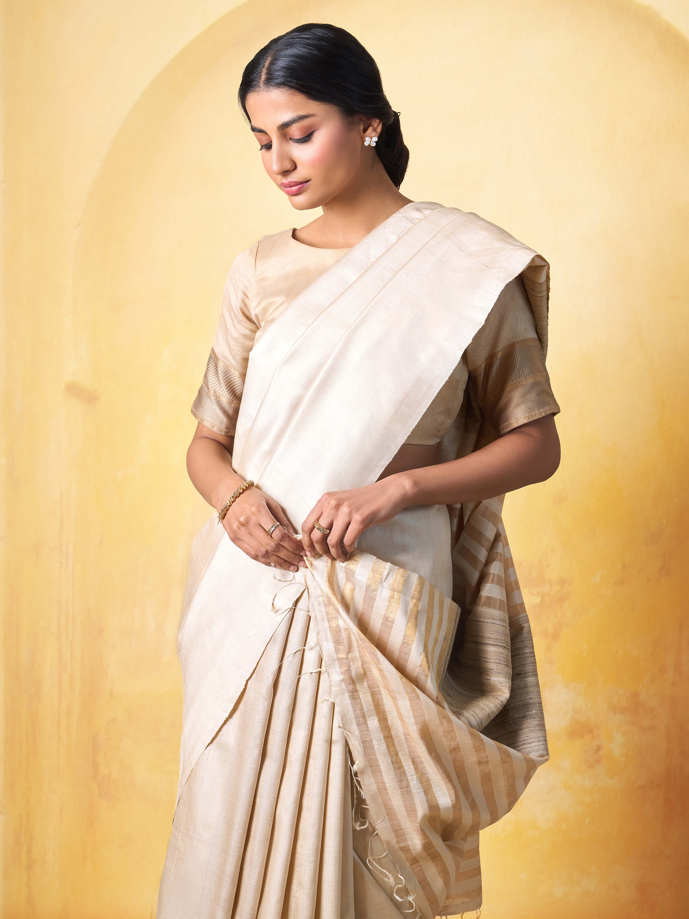 Draped side view capturing the flow and richness of the Tussar silk fabric