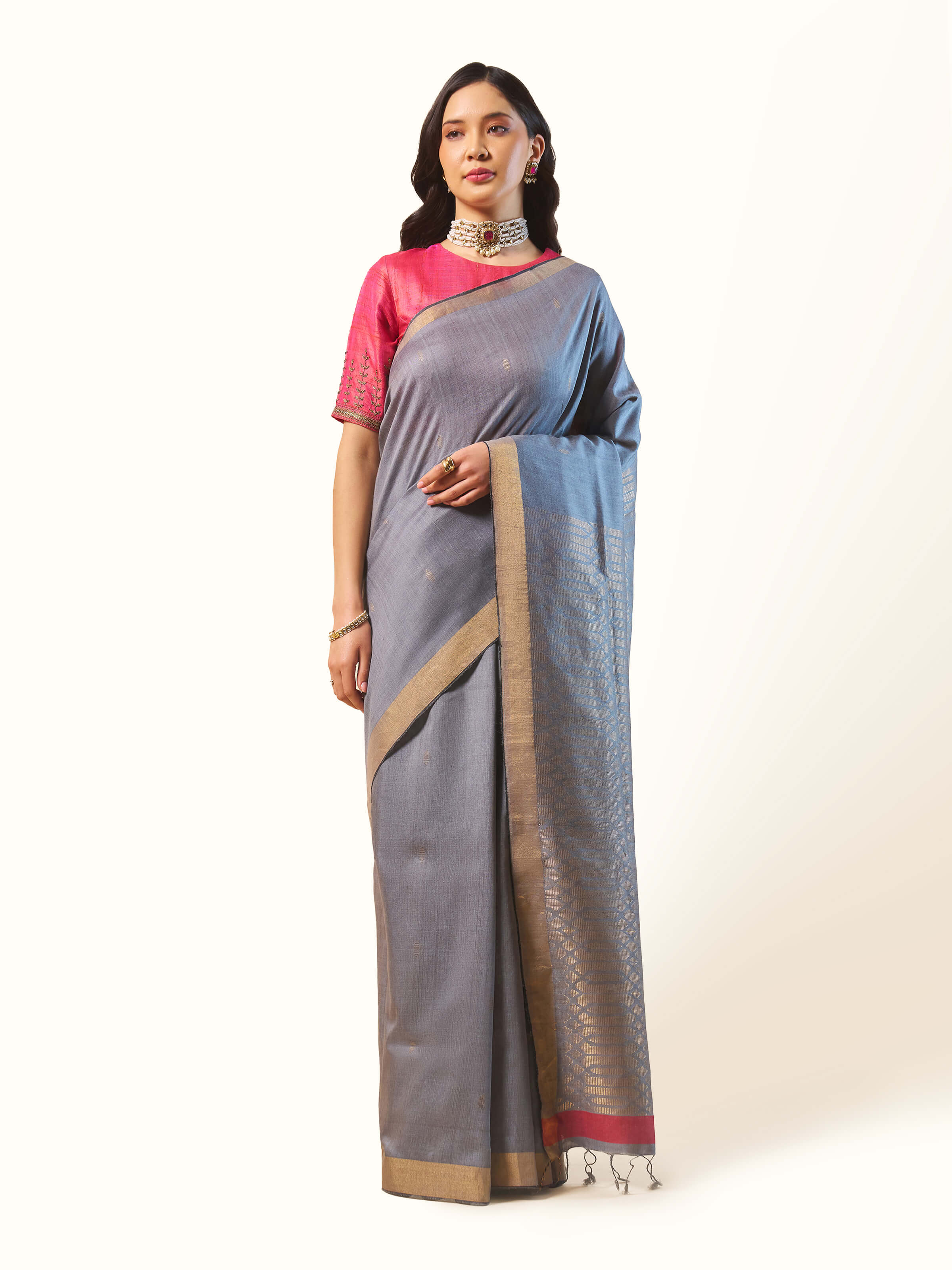 Front view showing the serene grey shade and elegant weaving of the saree.