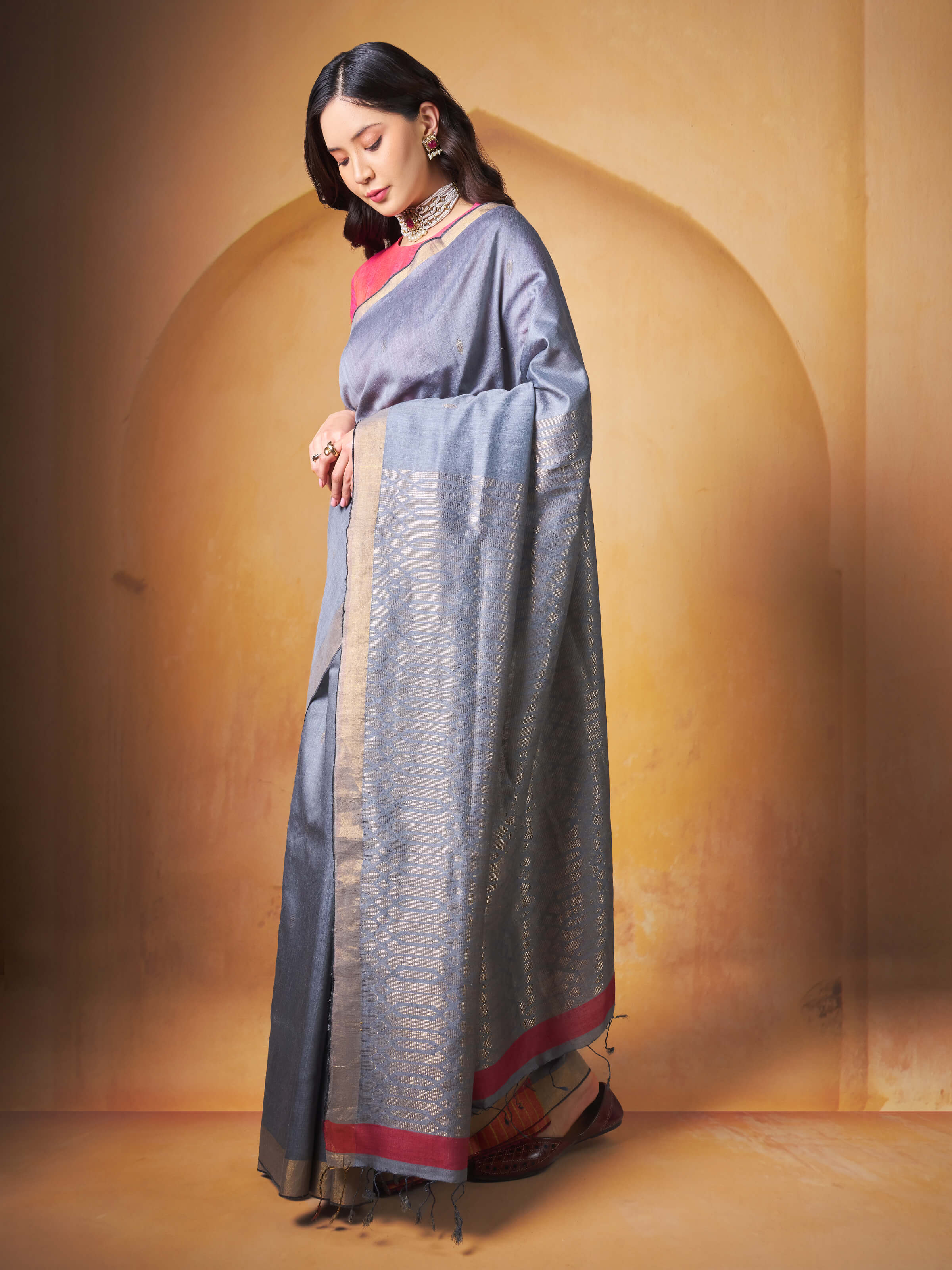 Side profile displaying the drape and natural sheen of the Eri silk.