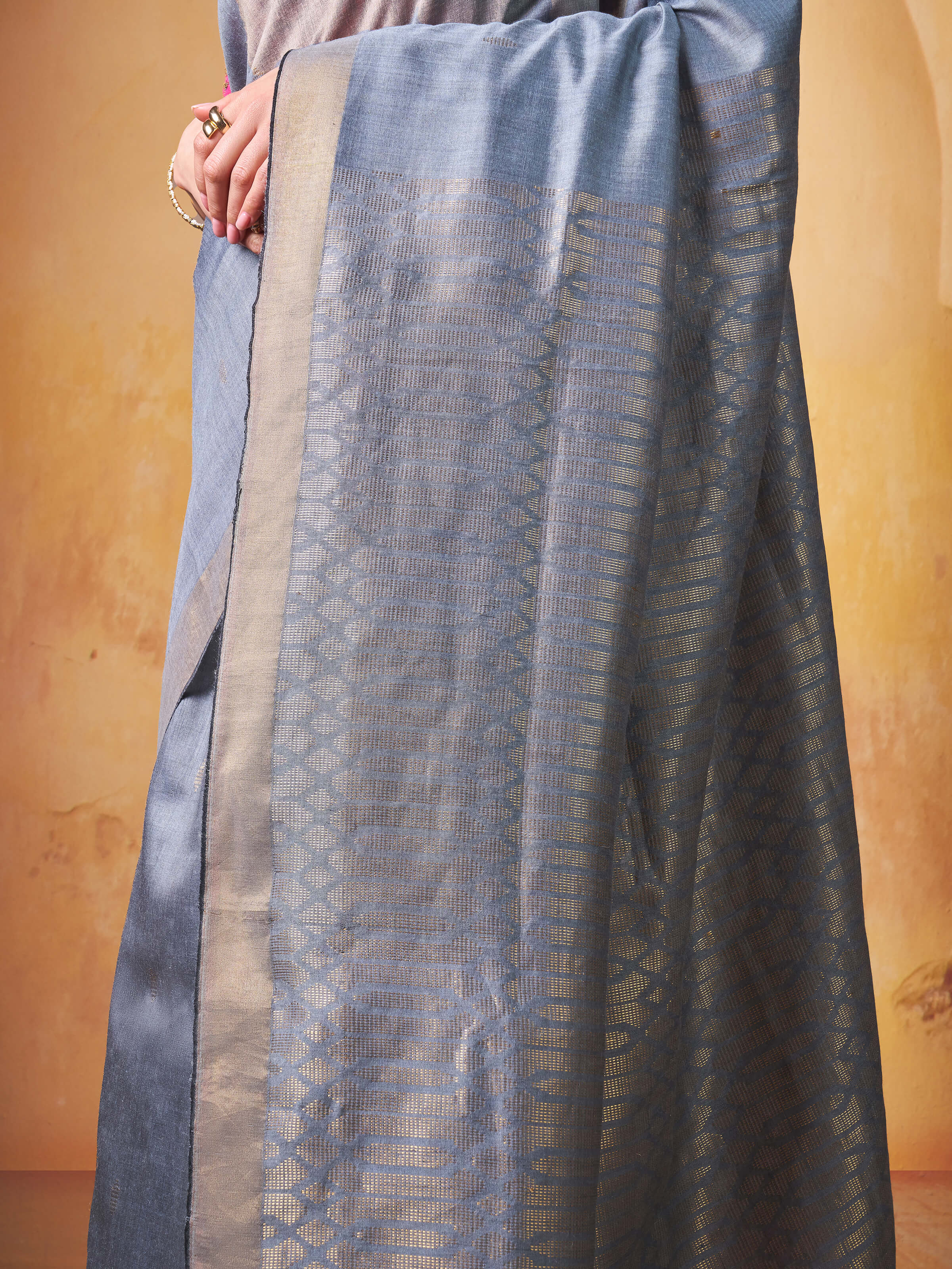 Draped shot showing the beautiful fall and traditional style of the saree.