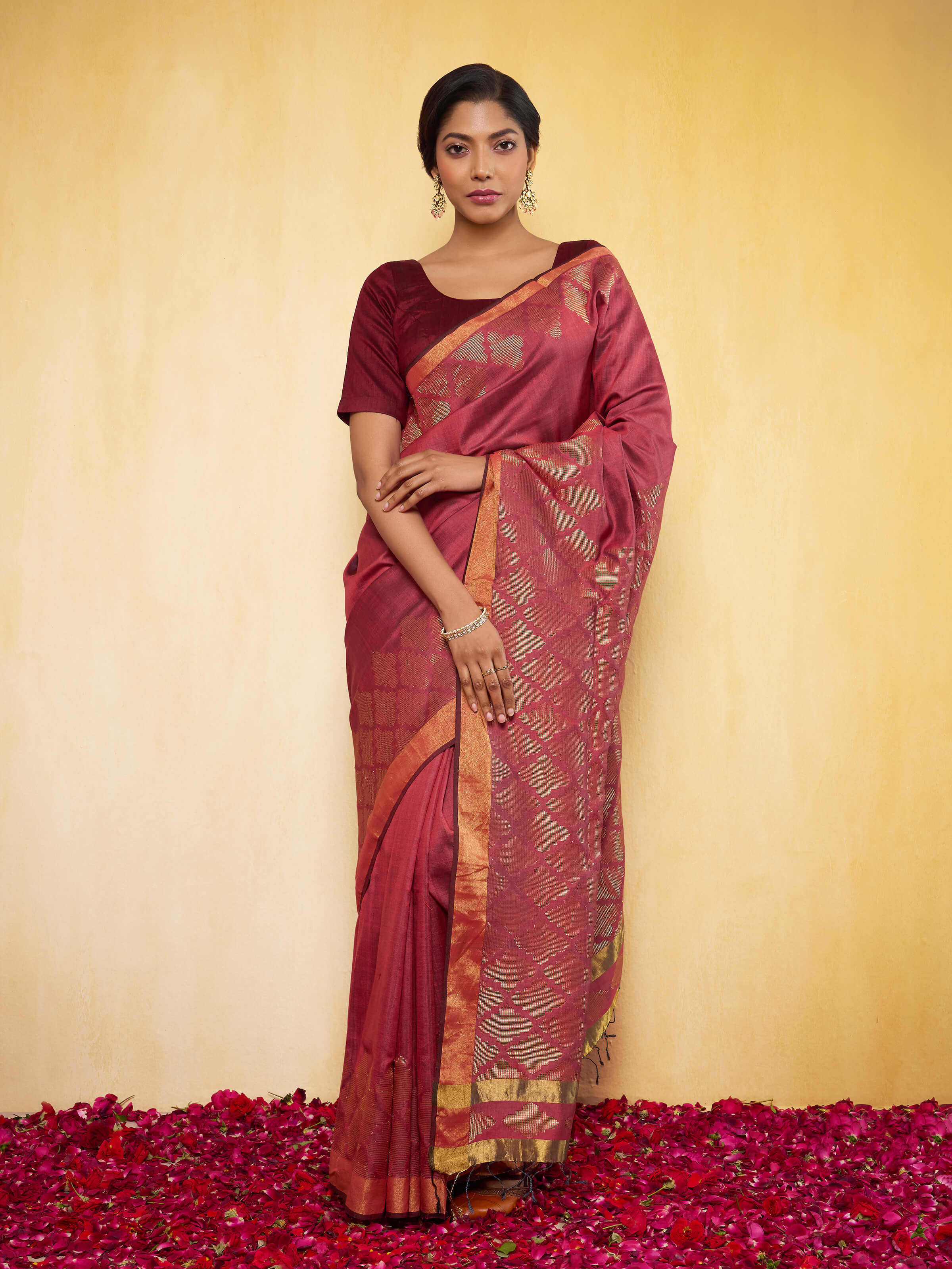 Lifestyle image of Maroon Eri Silk Extra-weft Saree worn traditionally with graceful fall.