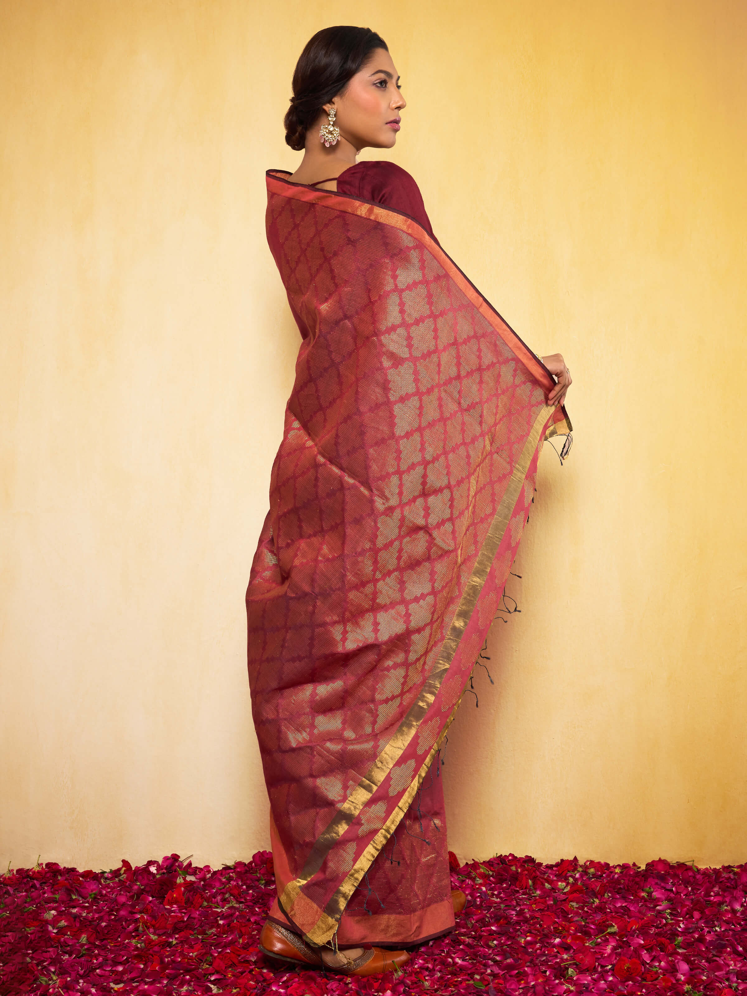 Angled close-up of Maroon Eri Silk Extra-weft Saree showing detailed weaving and fabric texture.