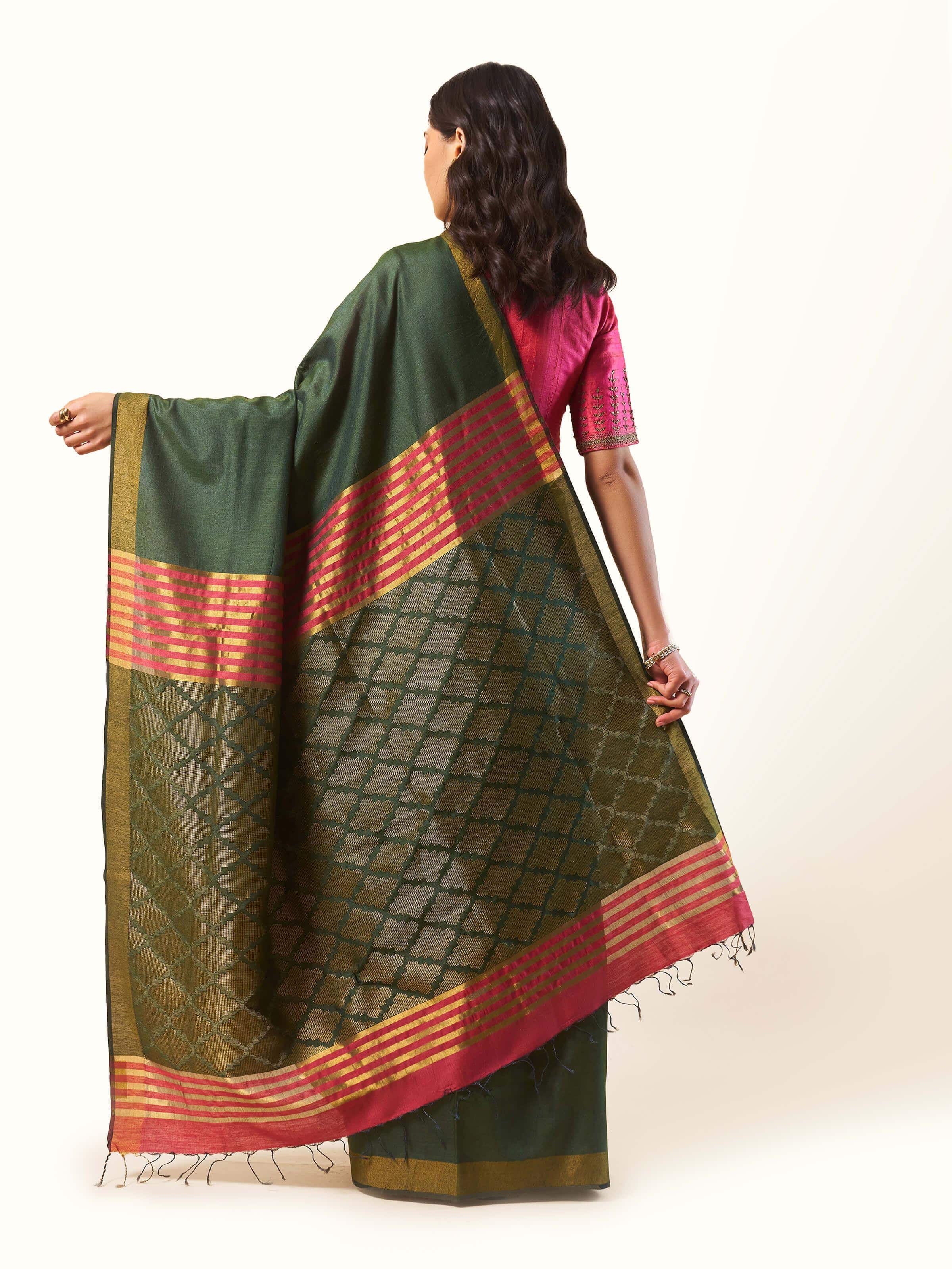 Back view highlighting the saree’s length and fall