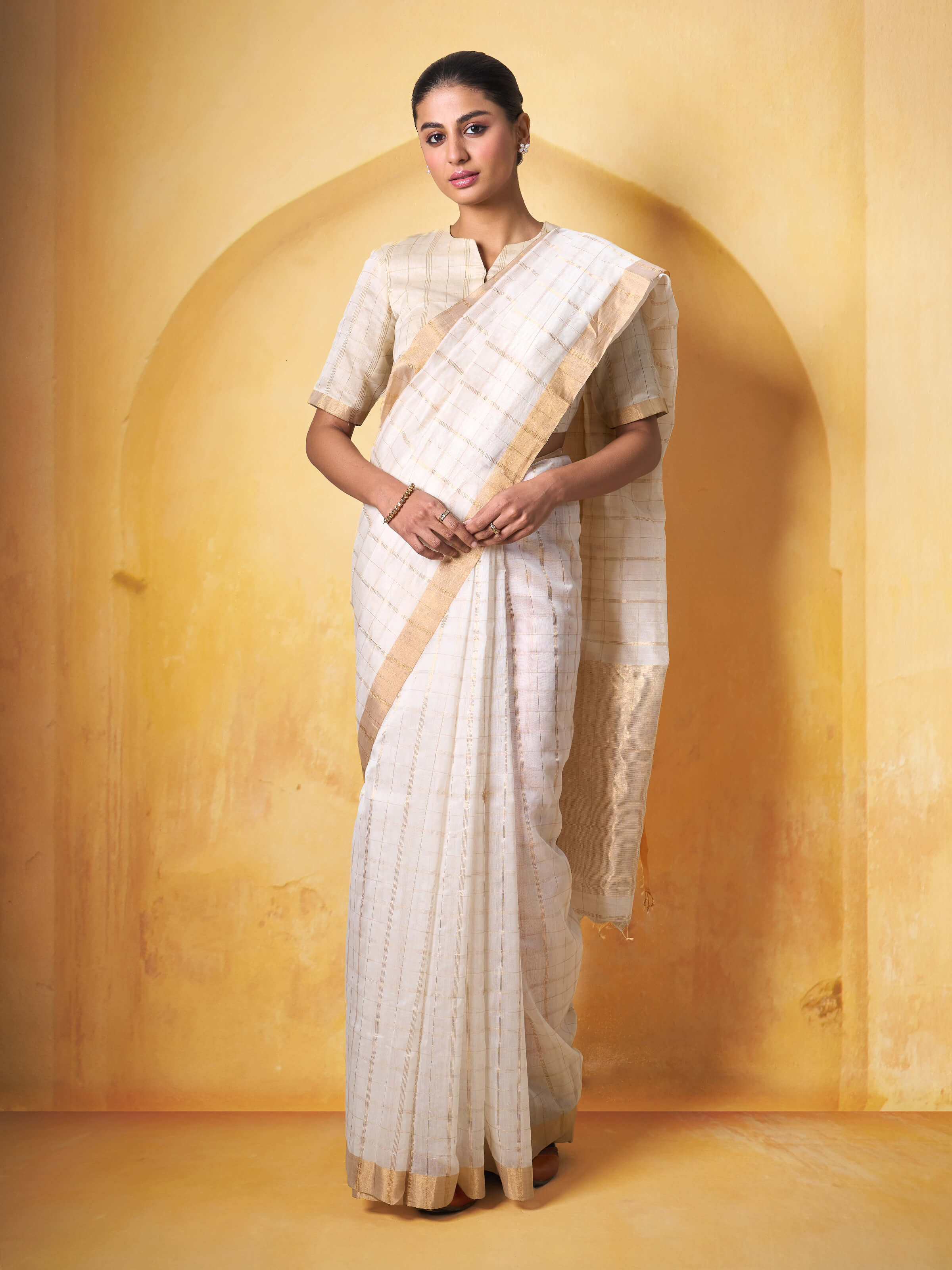 Lifestyle view of Off-white Cotton Silk Chanderi Saree draped elegantly showcasing cotton silk blend and delicate texture