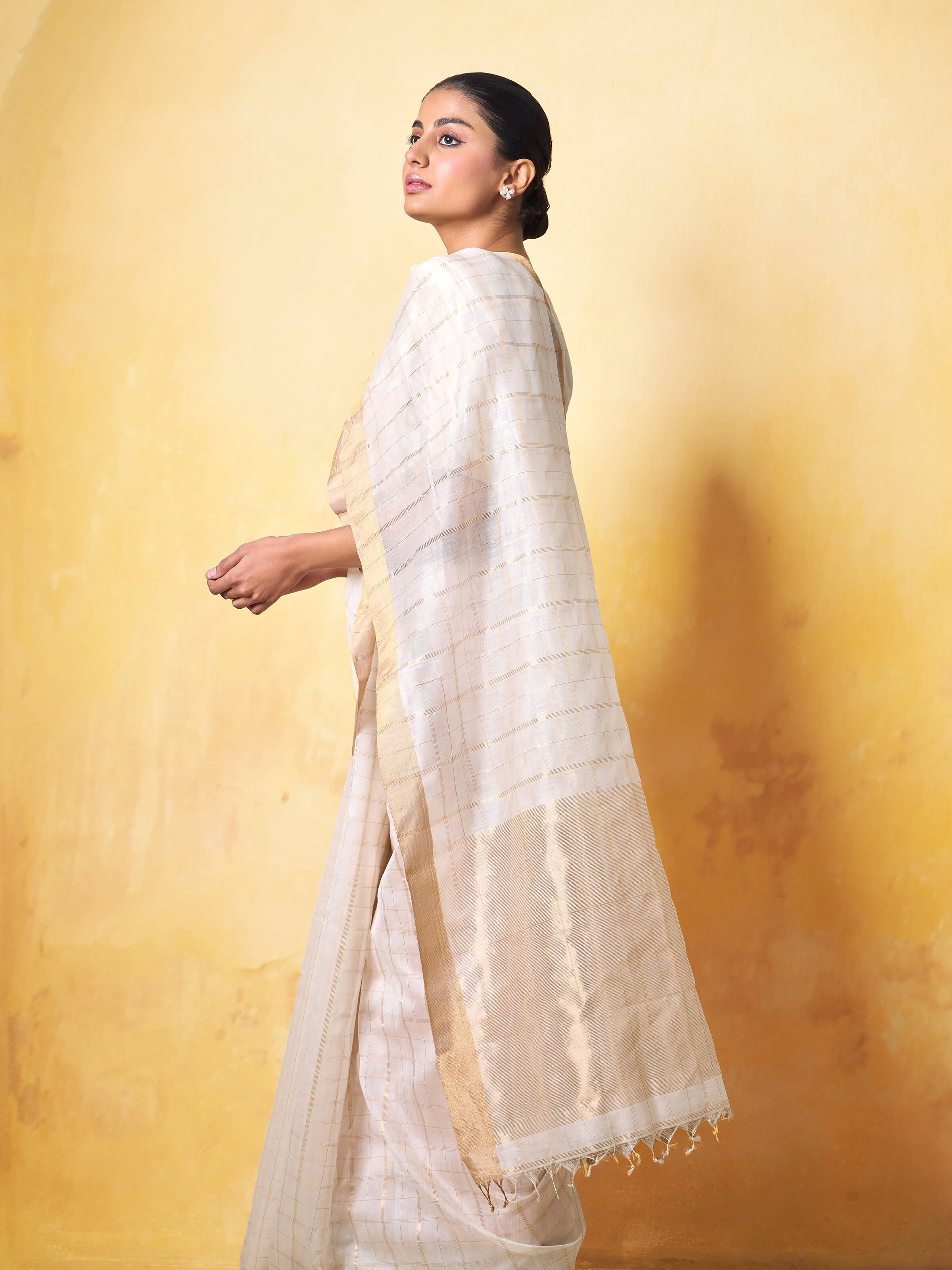 Angled view of Off-white Cotton Silk Chanderi Saree highlighting fine weave and flowing fabric