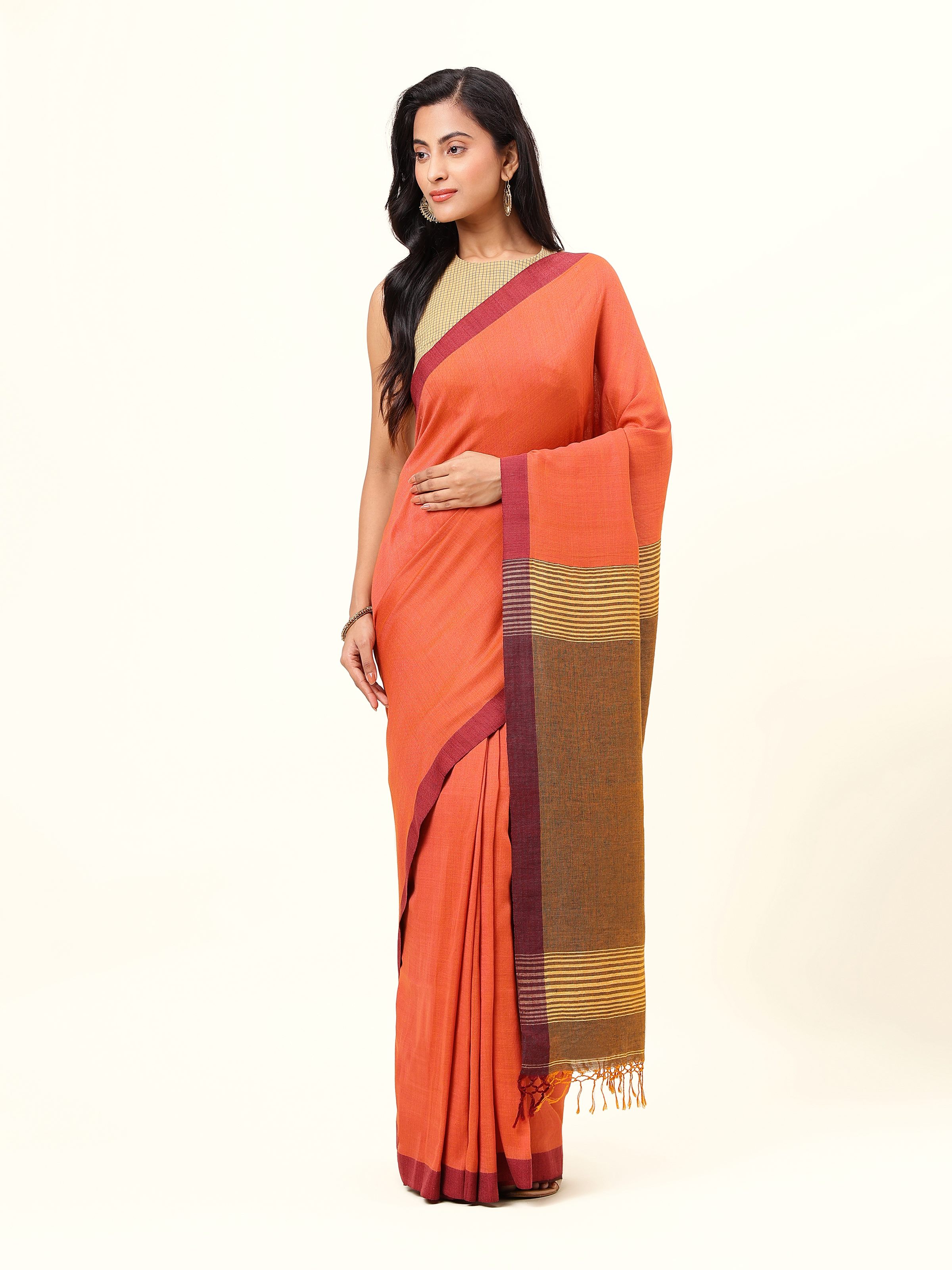 Front view of grey linen saree with understated sheen and solid border.